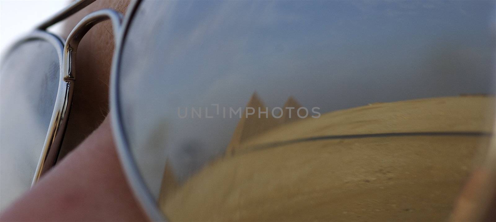 Reflection of all three Pyramids of Giza in sunglasses
