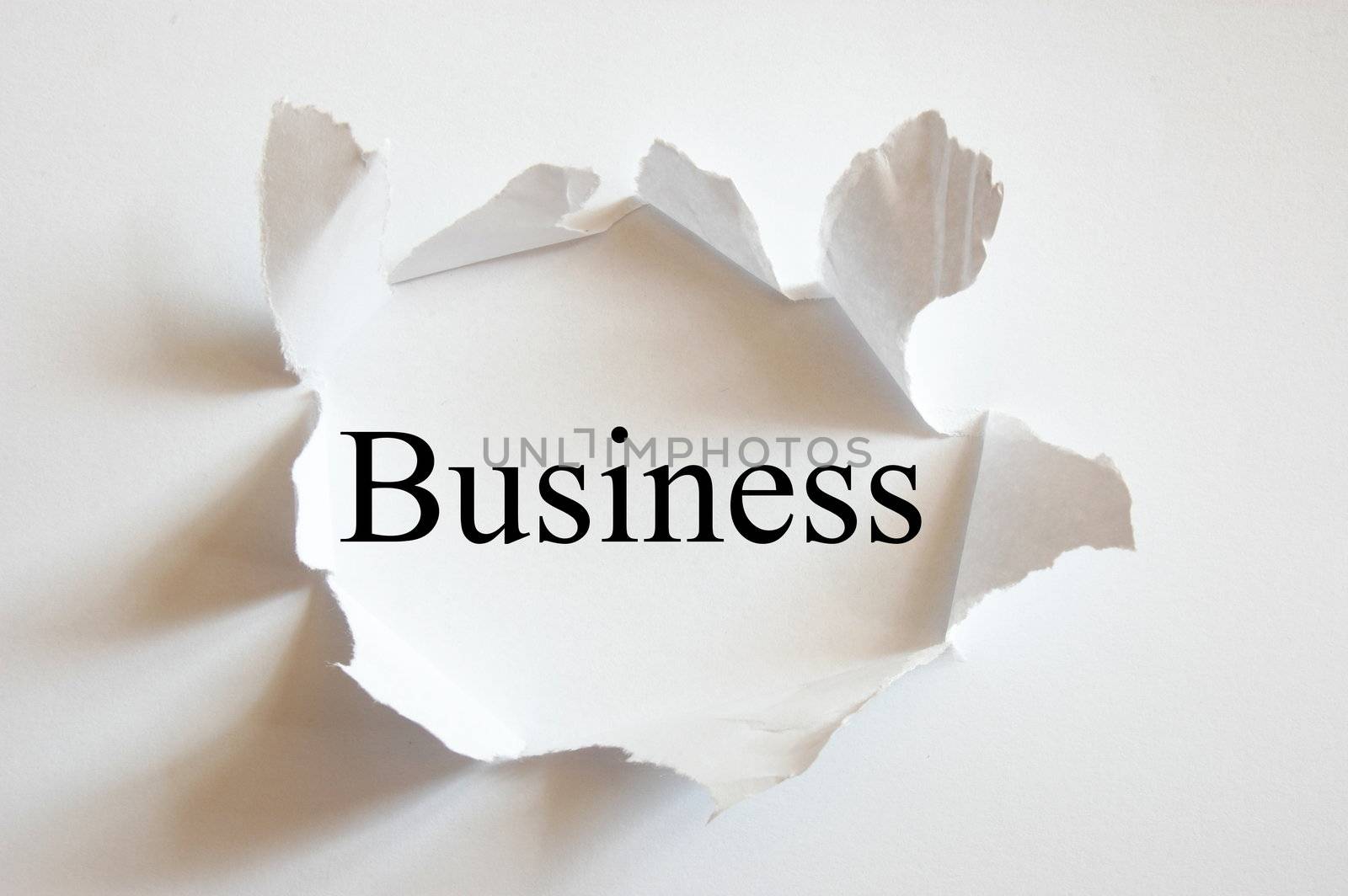 business concept with hole in white paper
