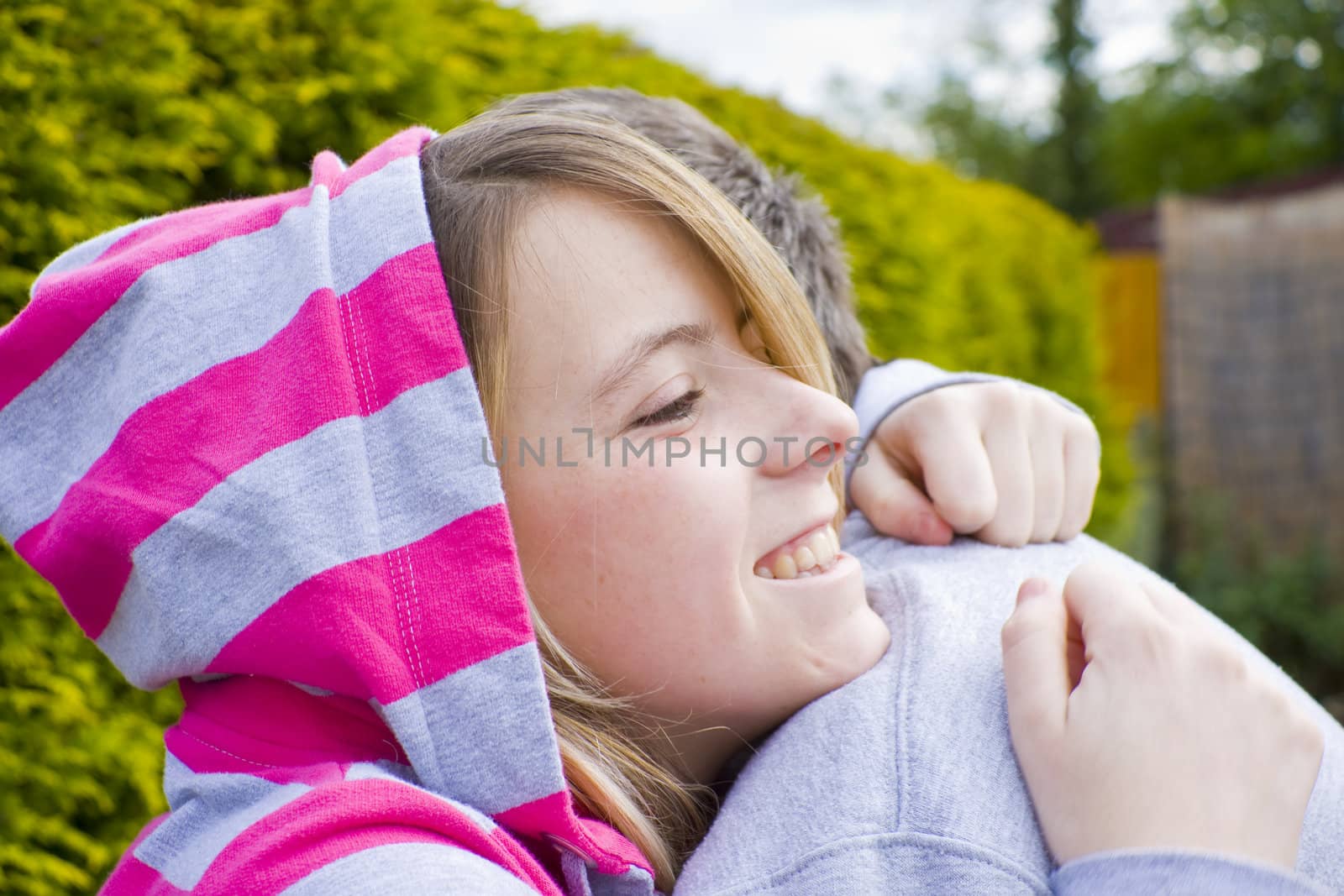 Young girl hugging her father.