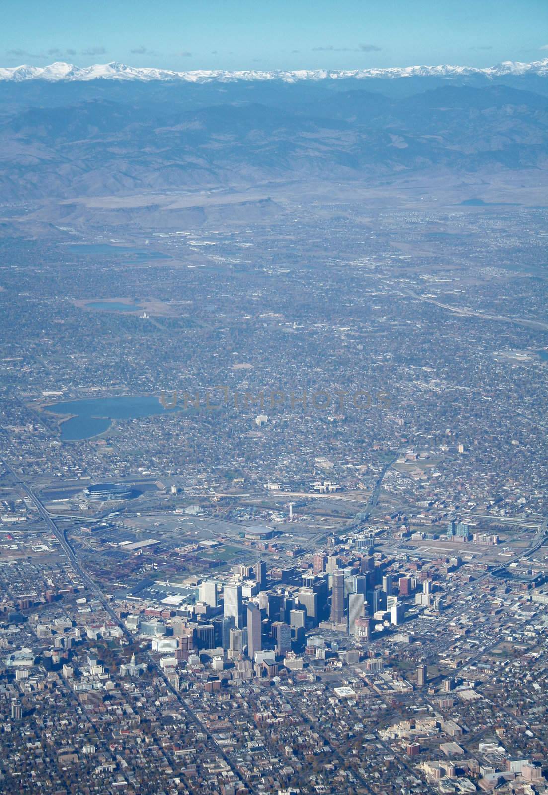 Aerial view of Denver Colorado and mountains with snow