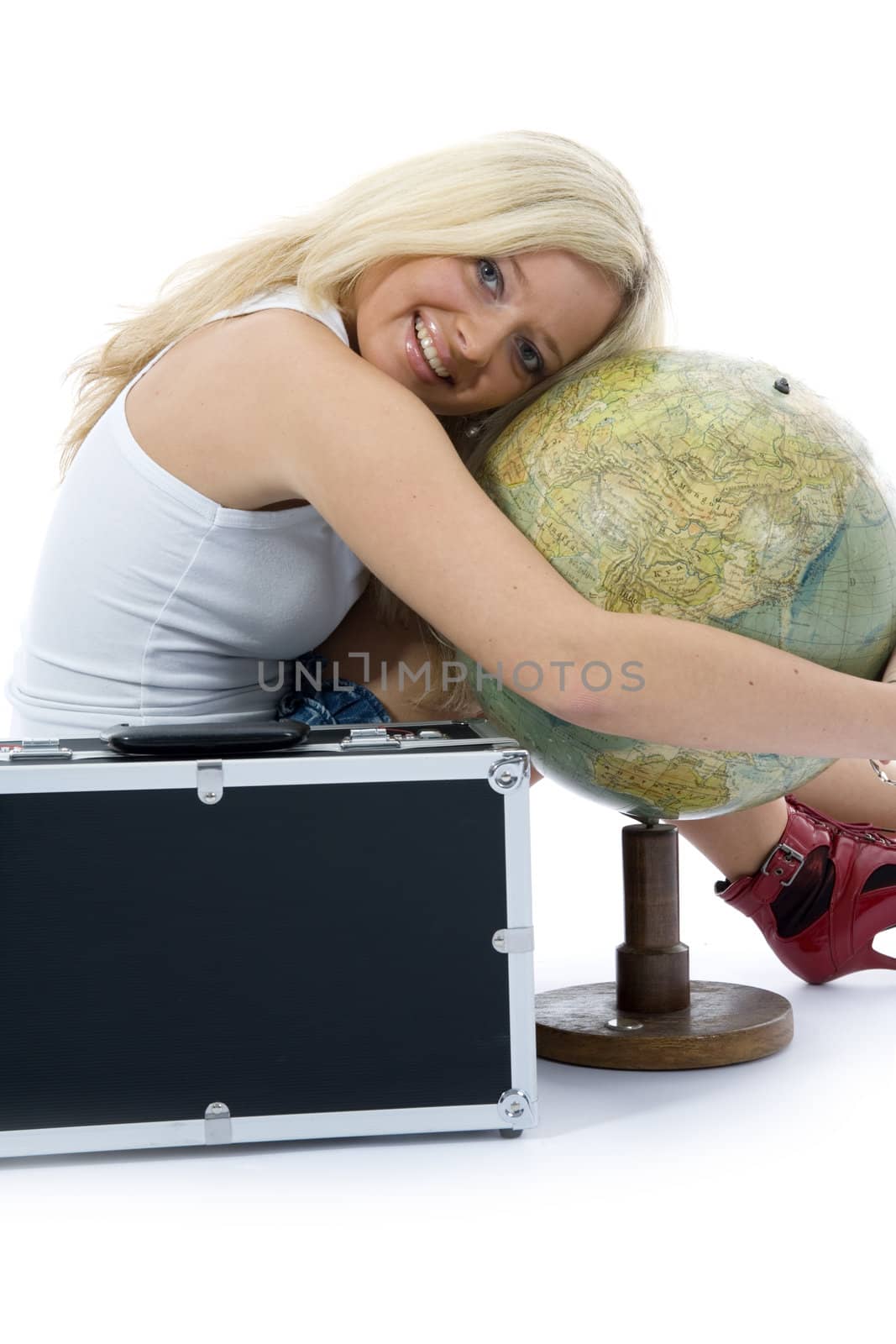 Beautiful blonde with valise and globe on isolated background