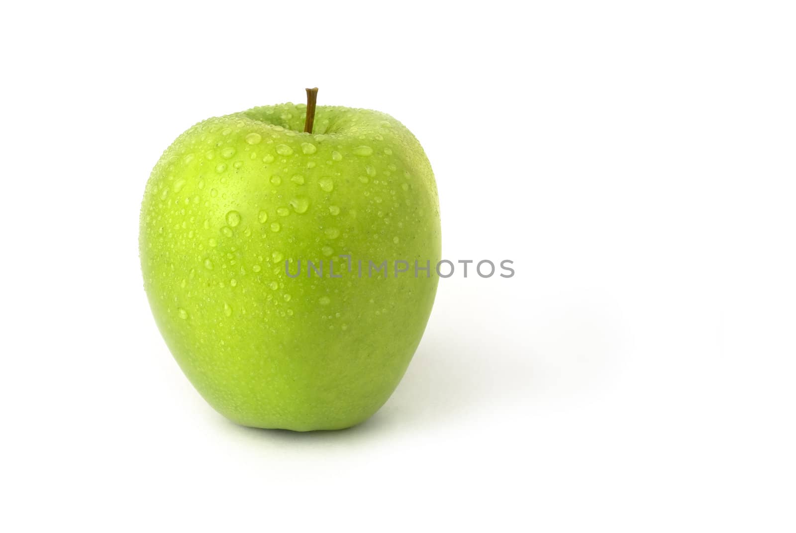 Green isolated apple with water droplets