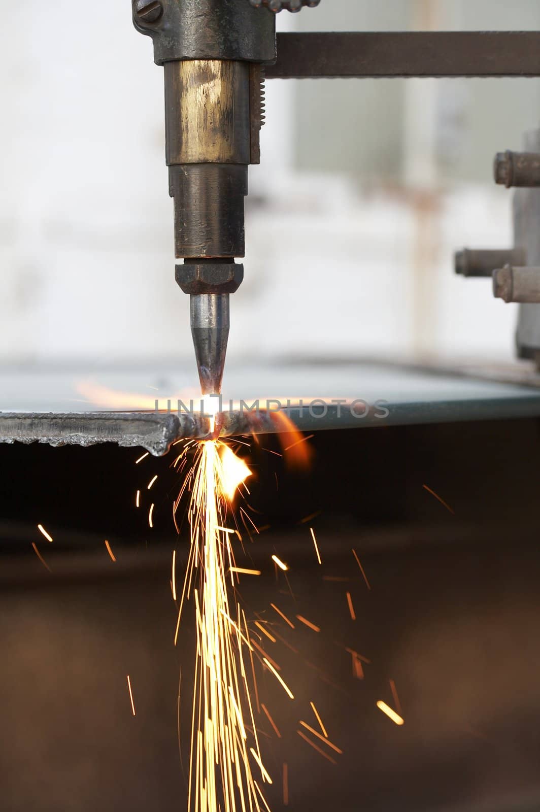 a close up of track torch burning steel