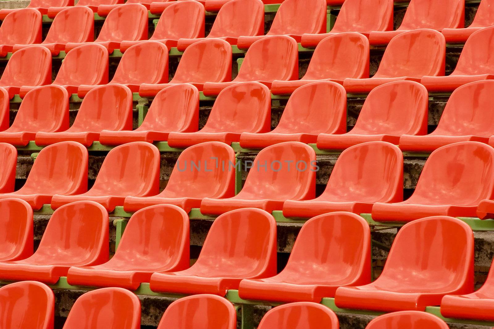 of The plastic bright red chairs, costing beside 