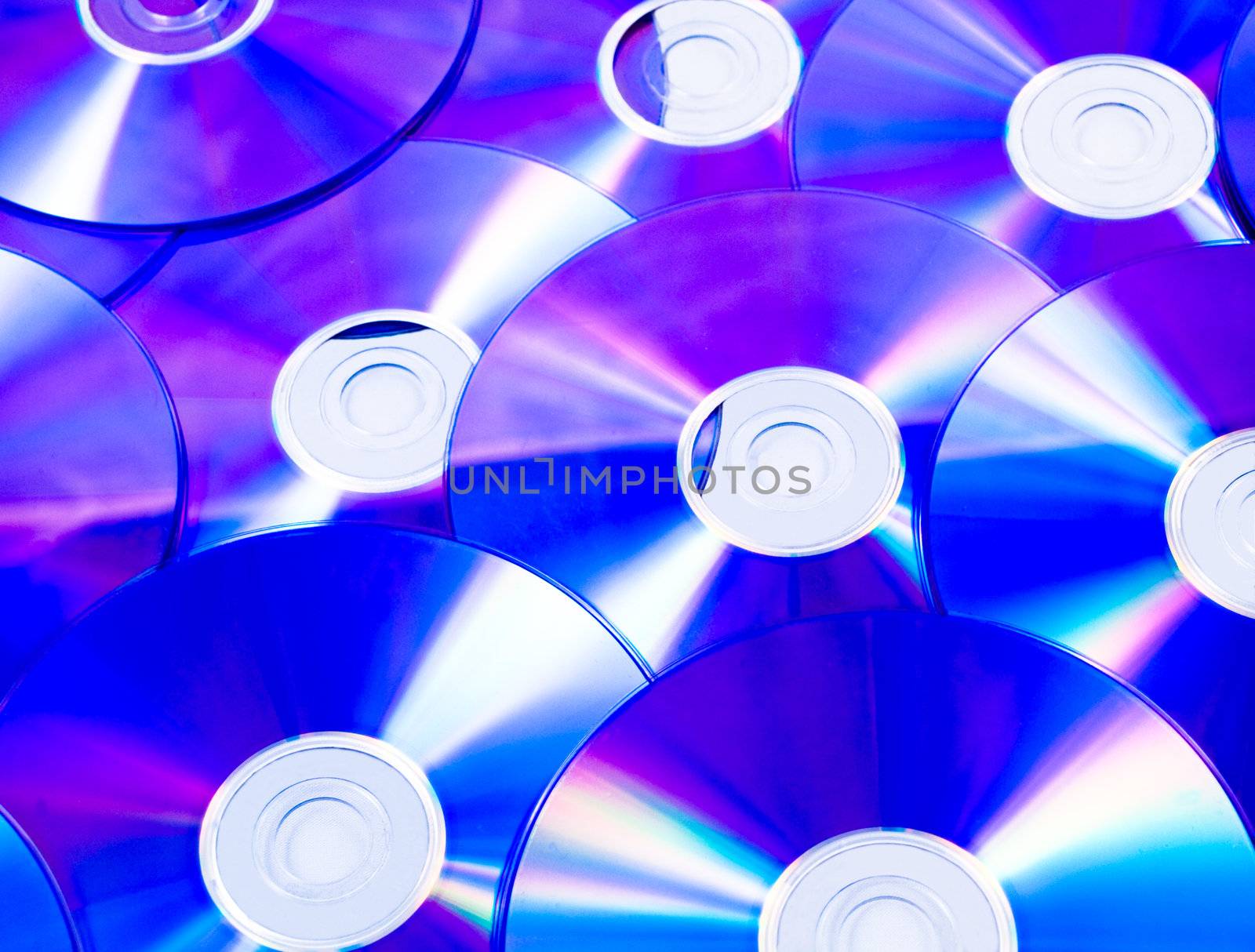 Closeup picture of a stack of blue dvds with reflections
