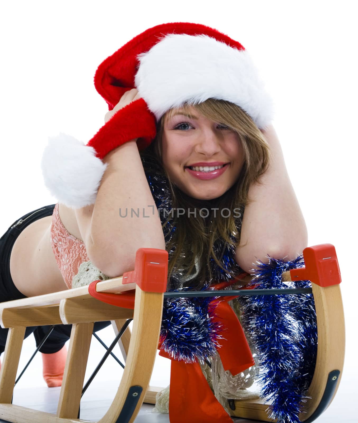 Beautiful  young woman on sledge on isolated background