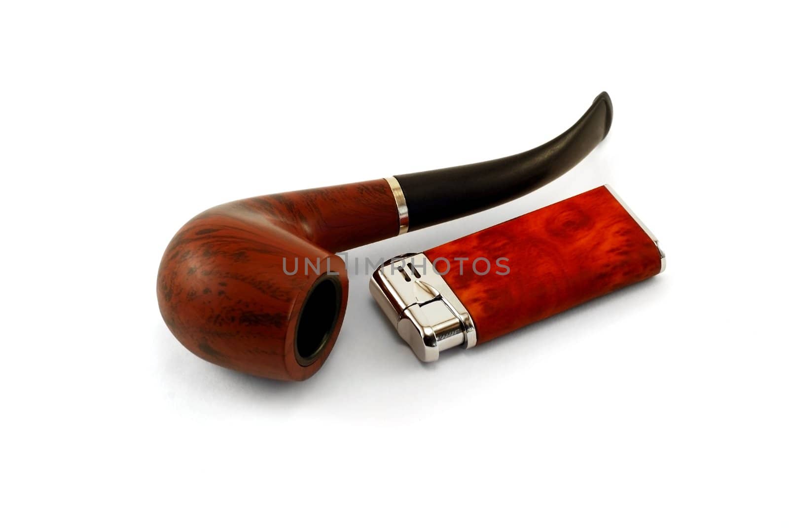 The tobacco-pipe and lighter are photographed close up on a white background