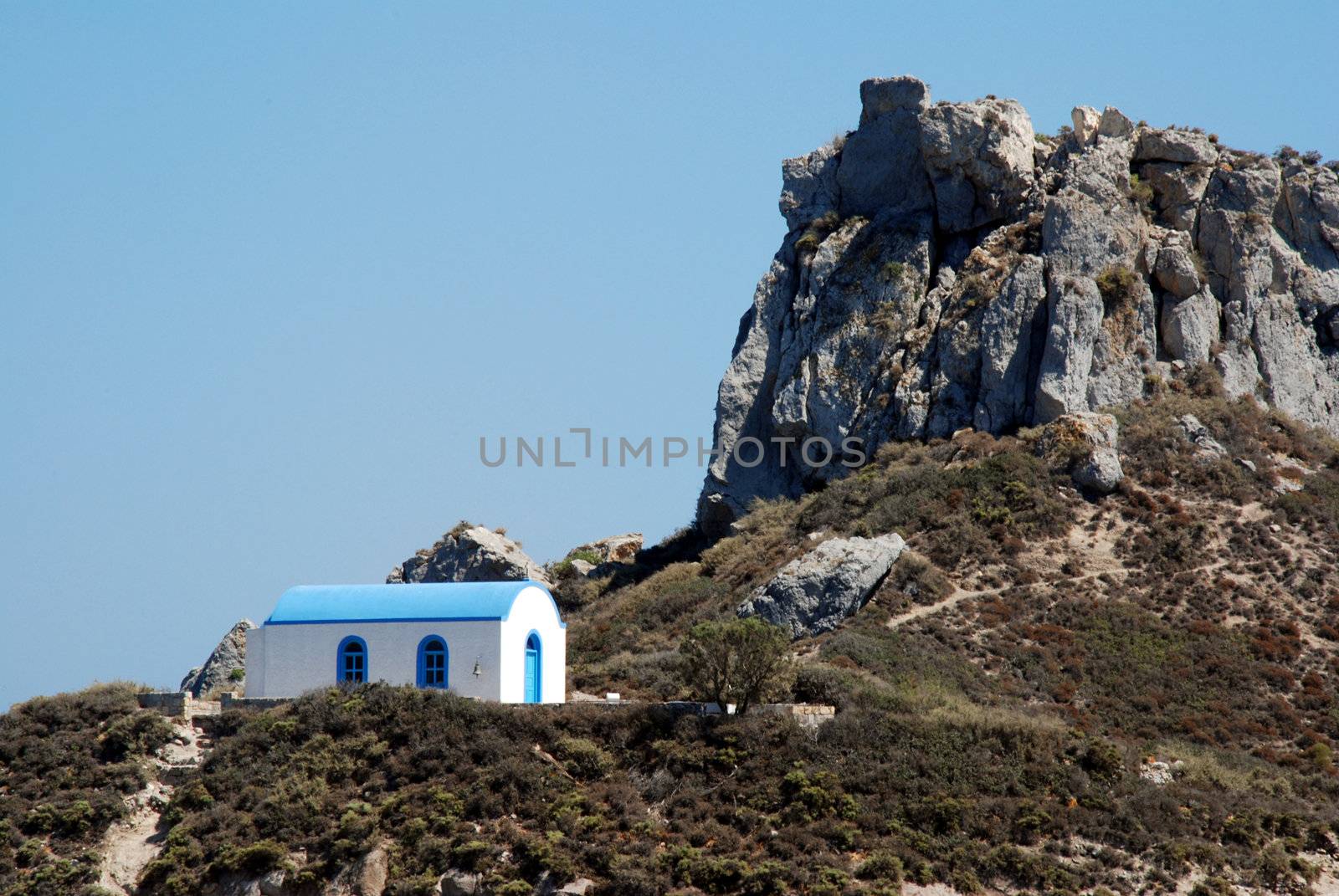 Romantic Greek wedding chapel and a mountain by fyletto