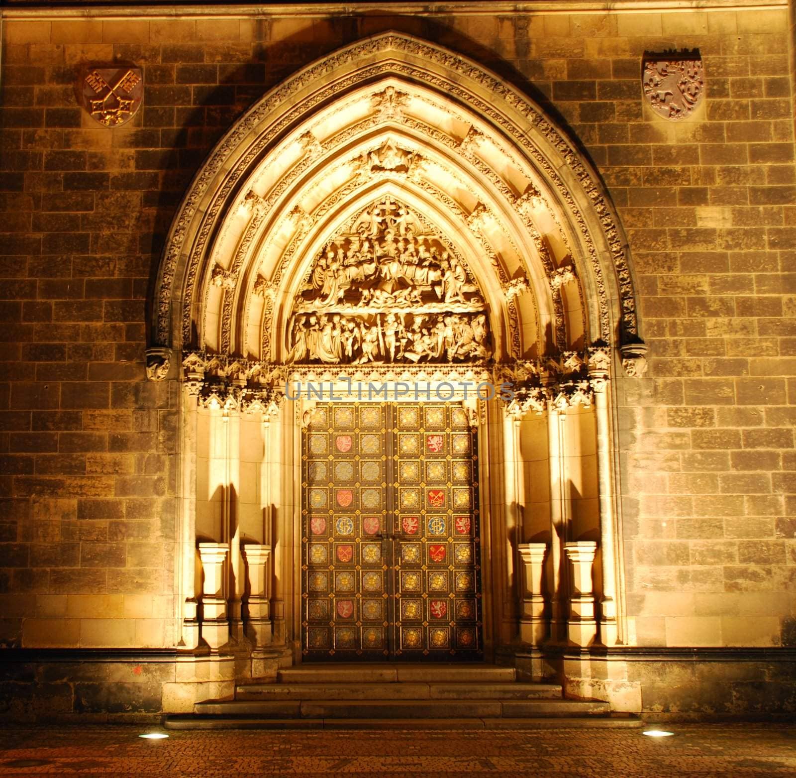 Illuminated portal of a czech cathedral on Vysehrad in the night