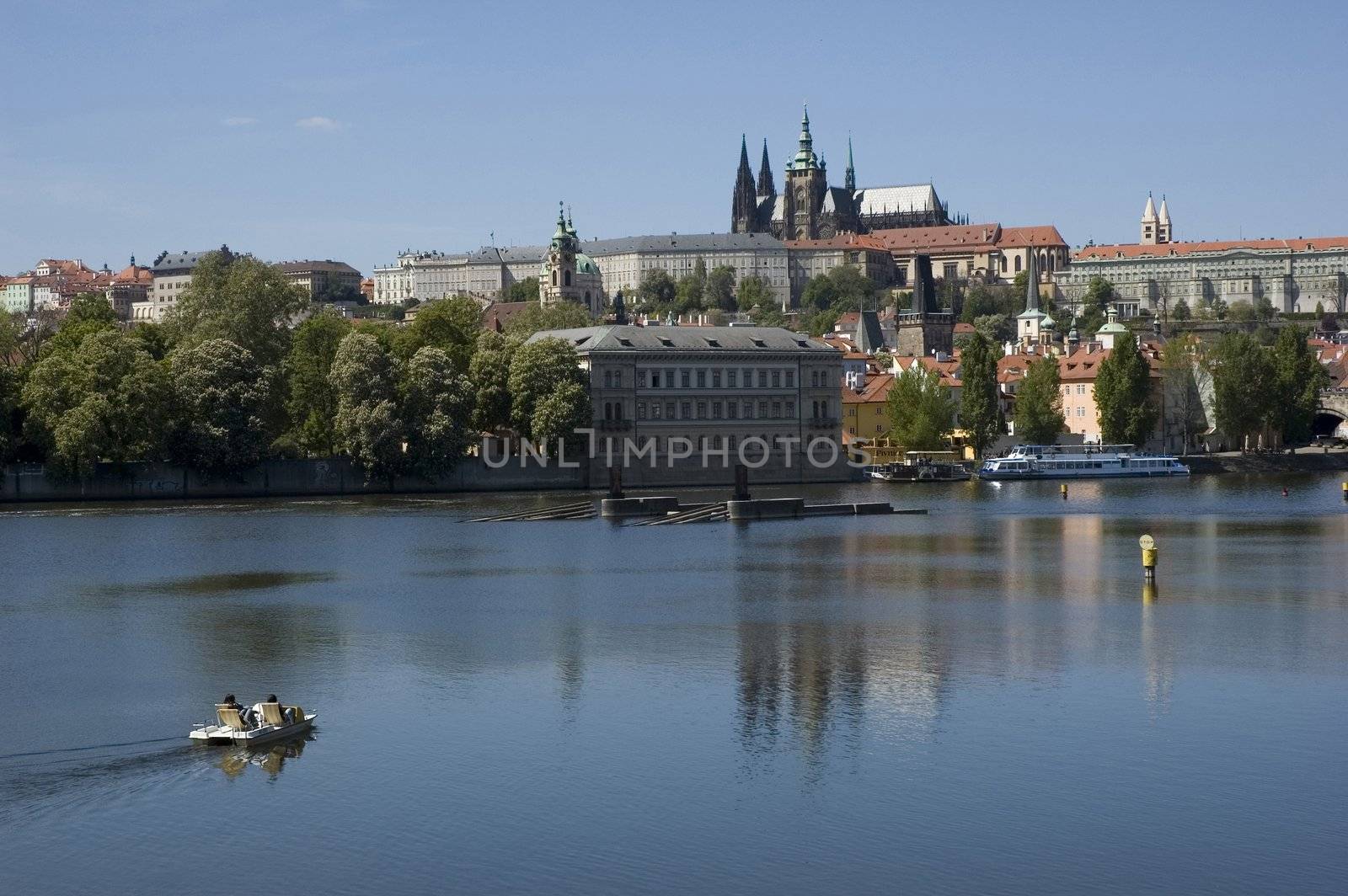 Tourists on a pedal boat on the river in Prague