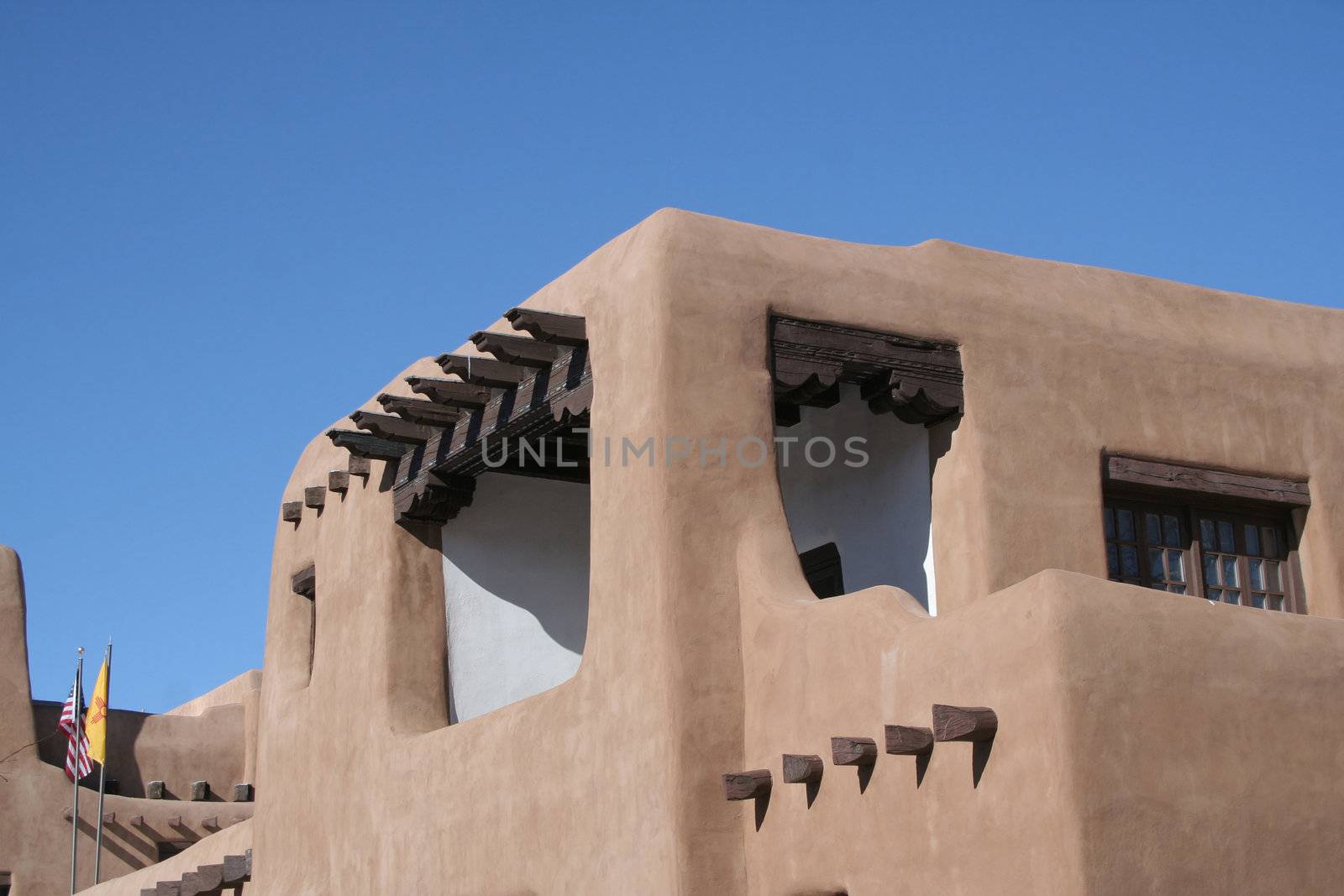 Adobe style building with wood beams