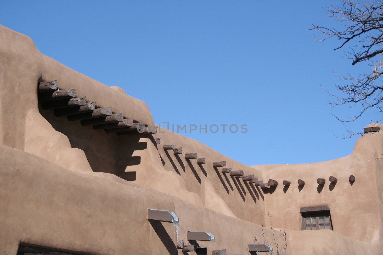 Adobe style building with wood beams