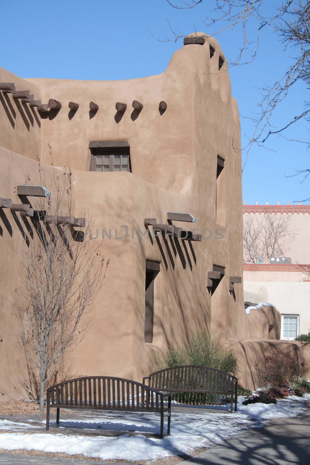 Adobe style building with wood beams