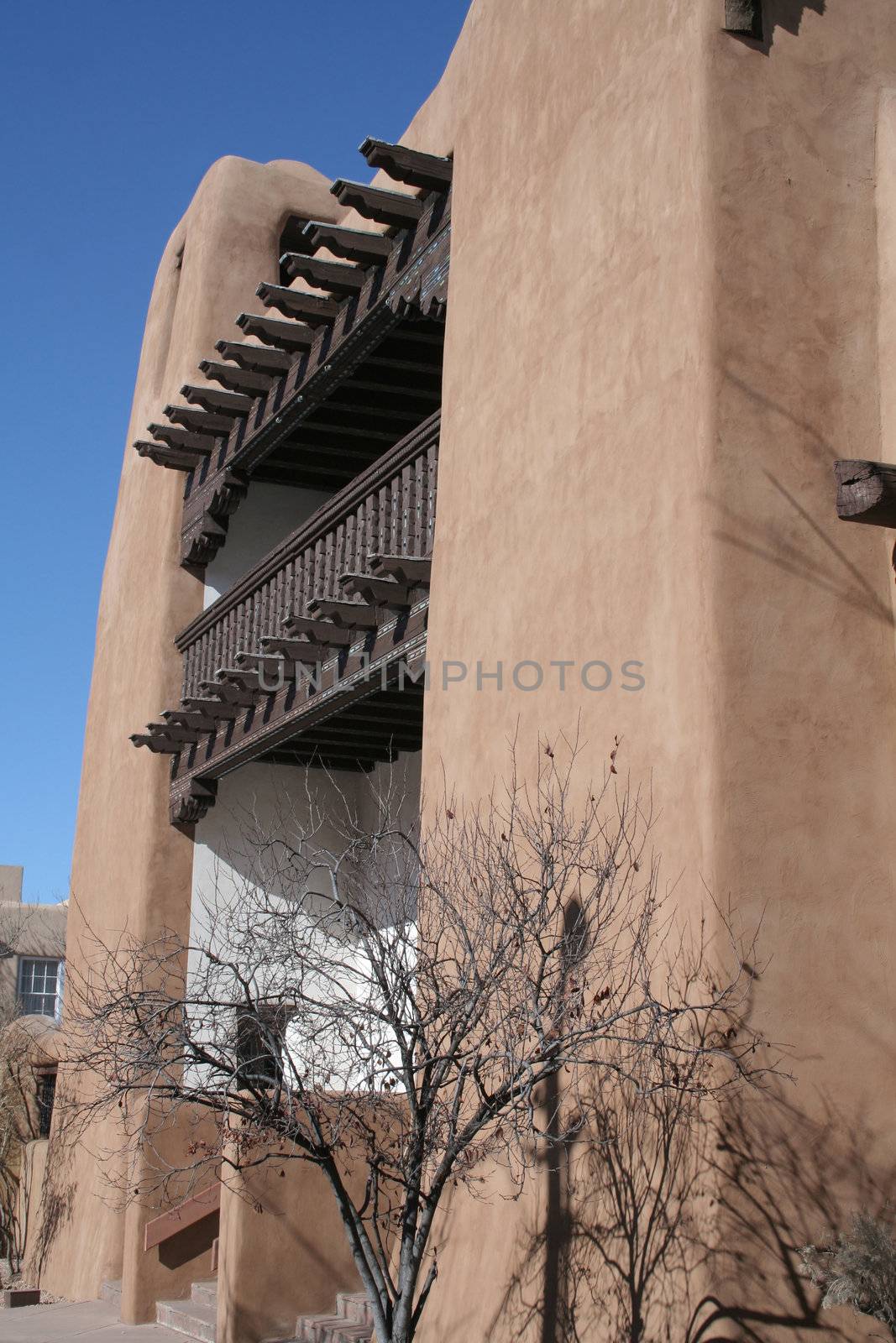 Adobe style building with wood beams