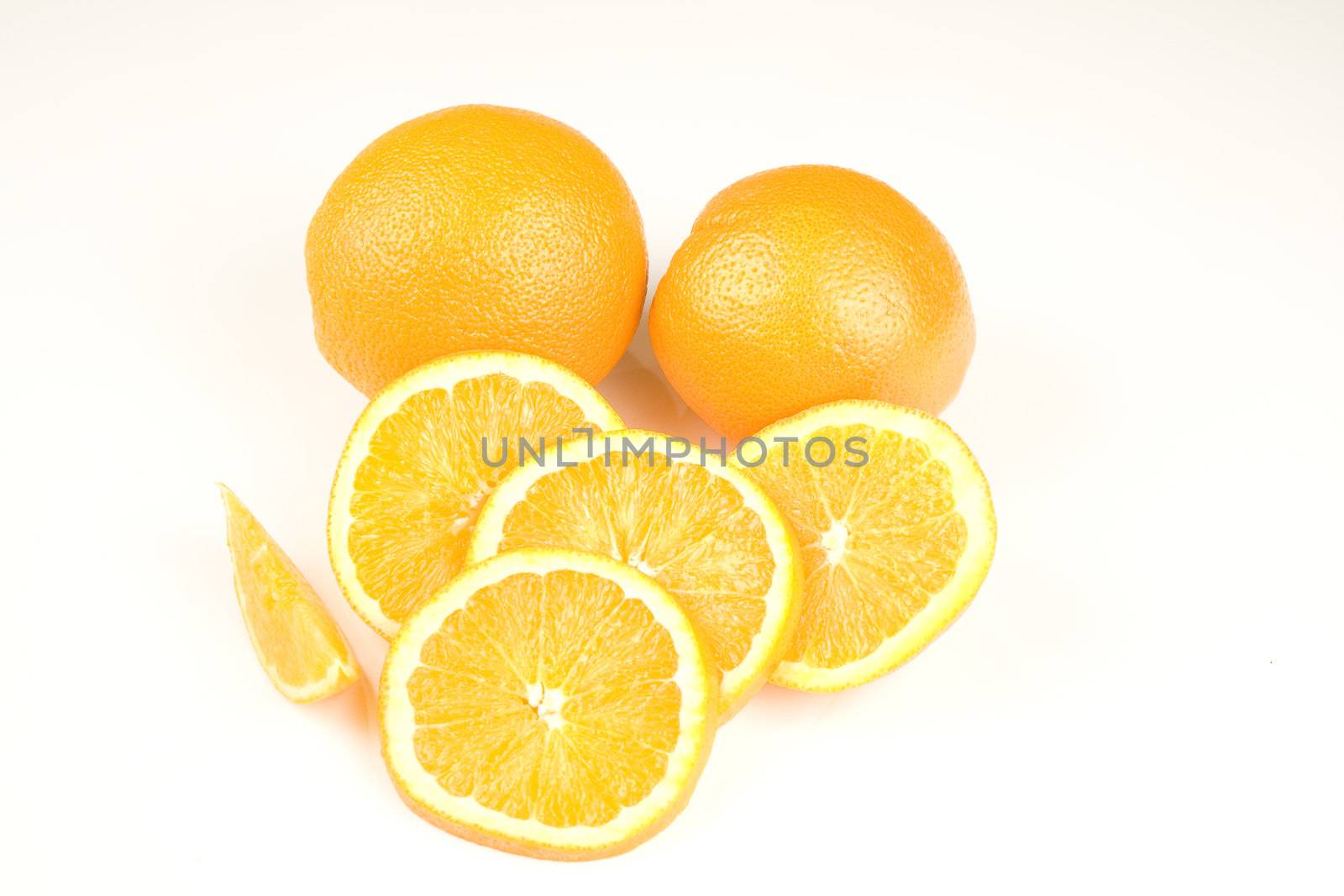 Oranges and slices isolated on white background