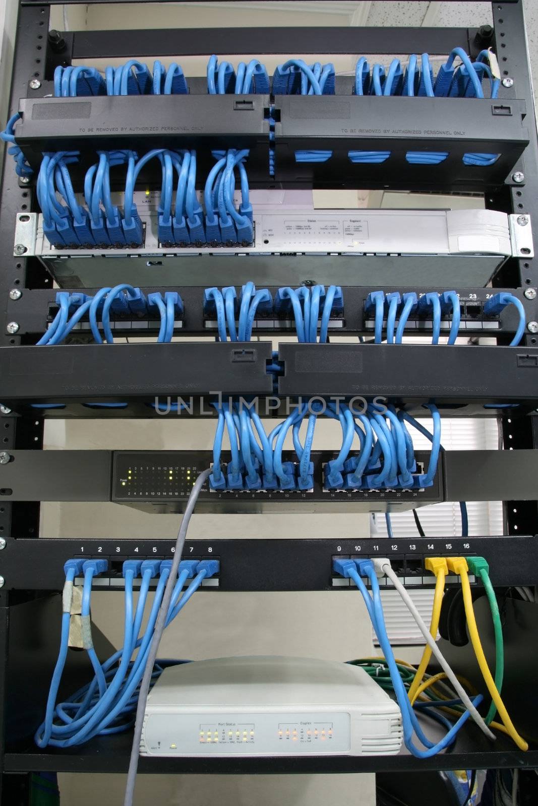 cabling rack with patch panels hubs and switches
