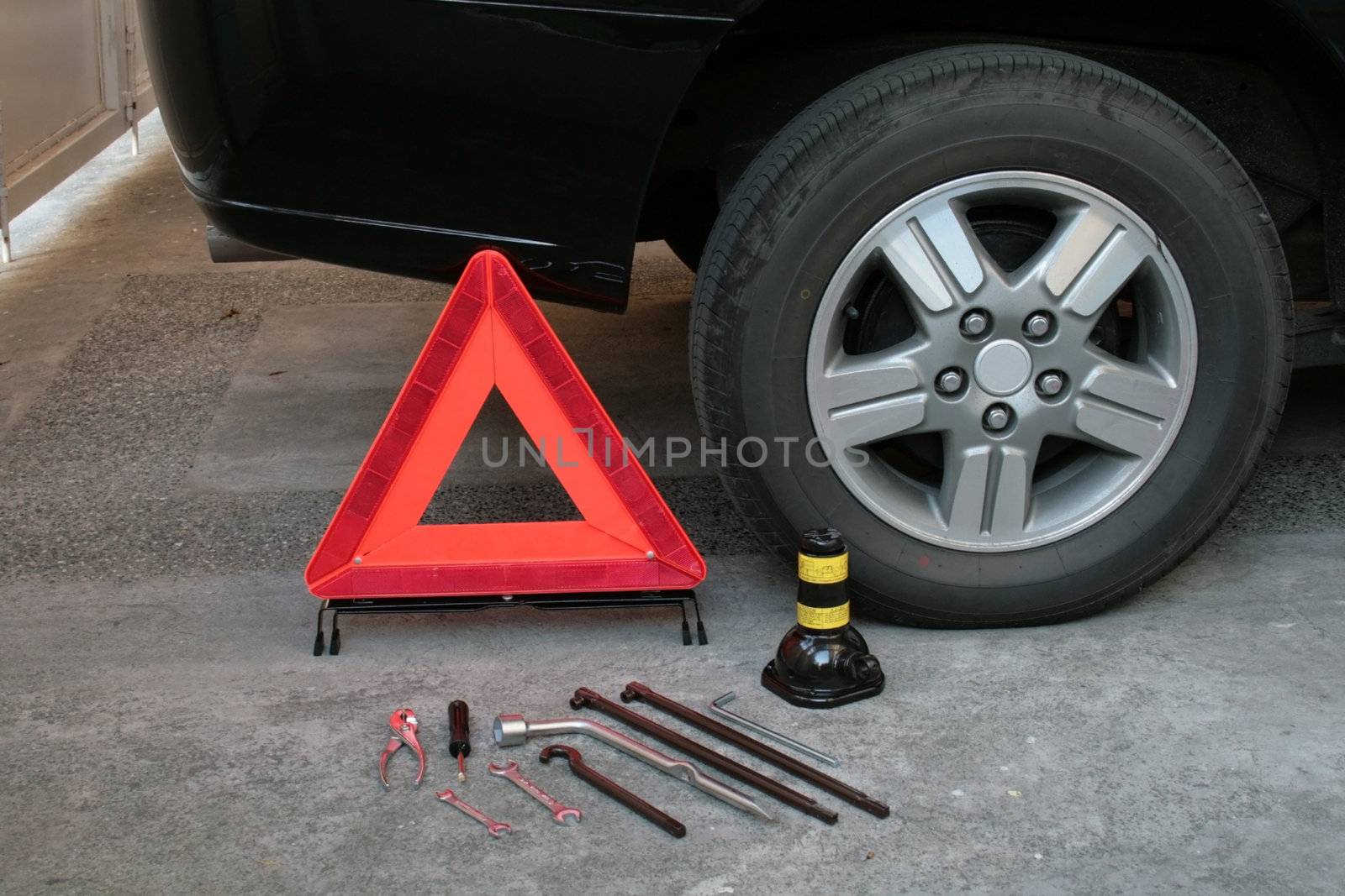 early warning device with tire changing tools
