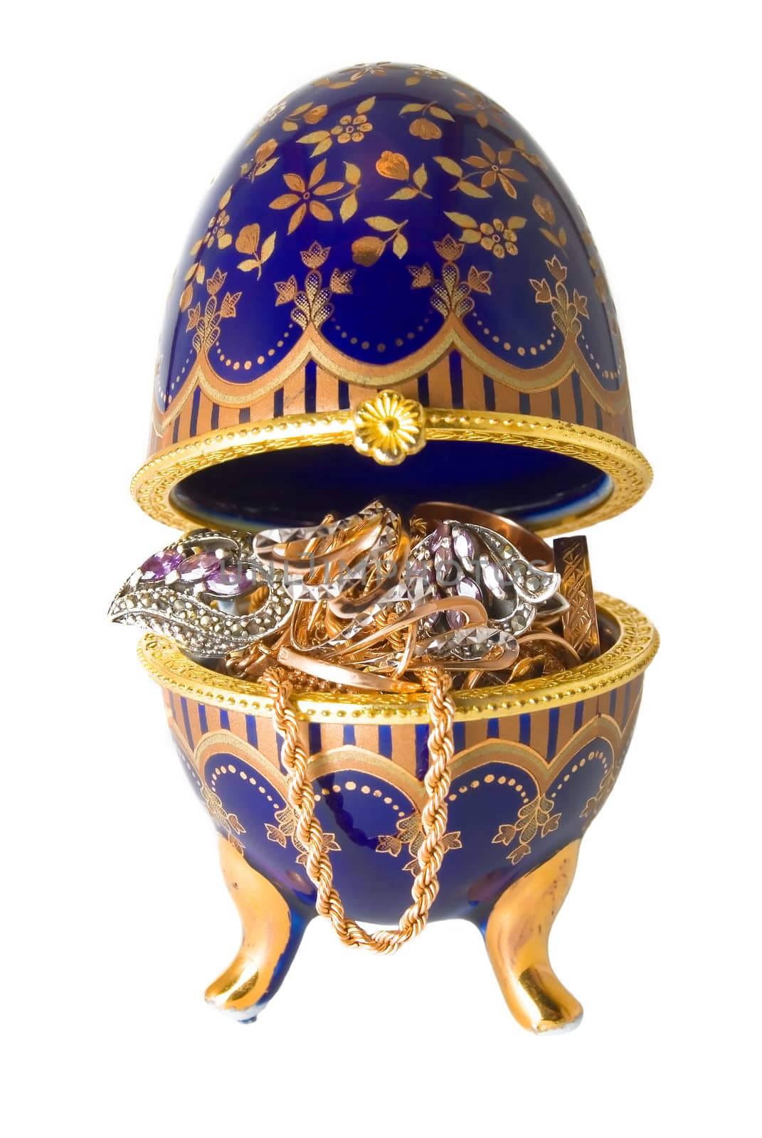 Gold ornaments are photographed in a casket in the form of egg