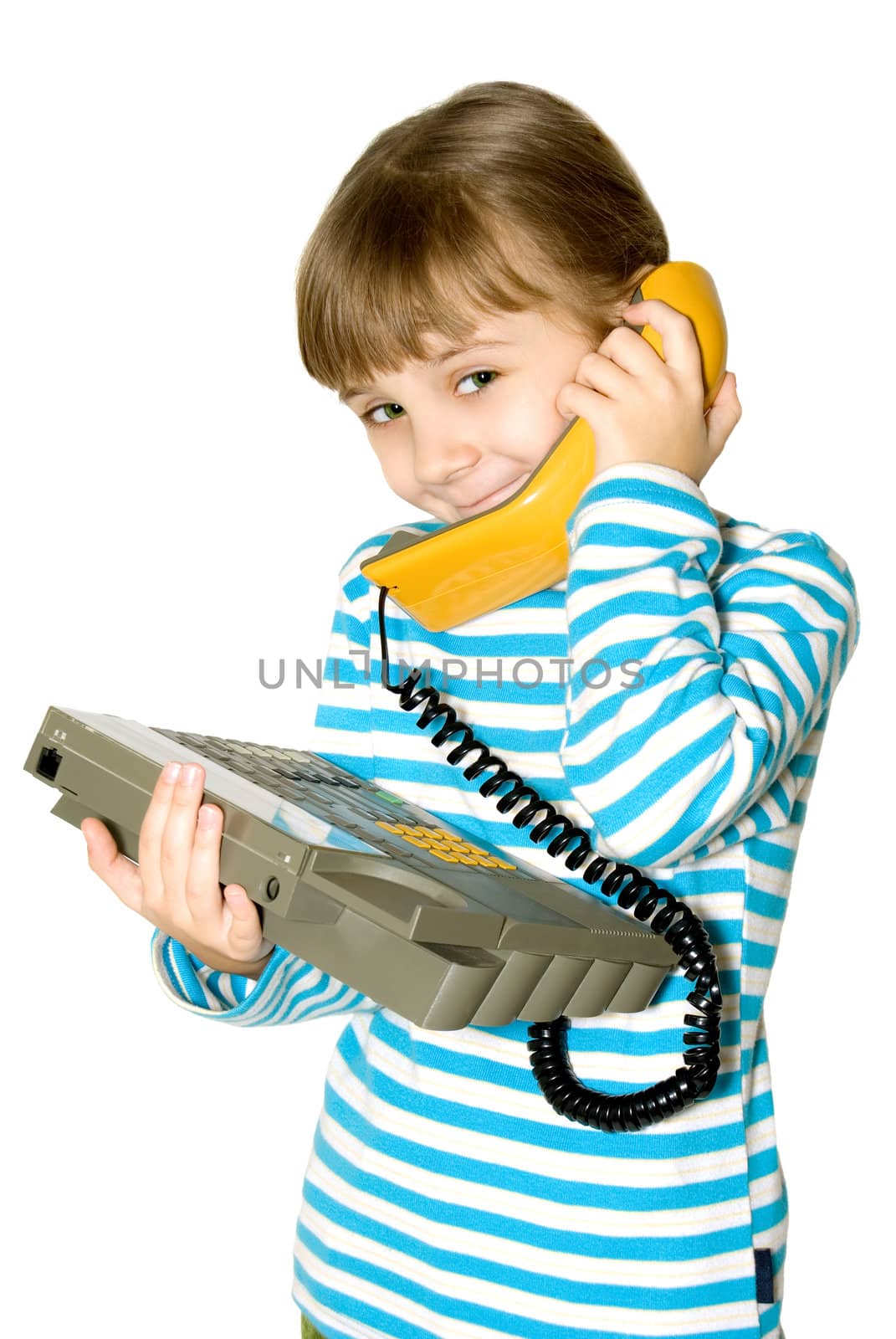 The girl speaks by phone with a yellow handset
