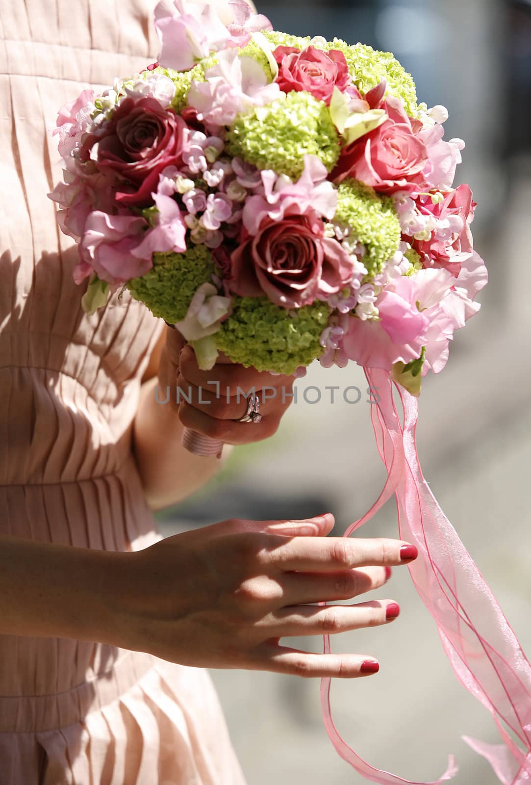 Wedding bouquet in hands of the bride