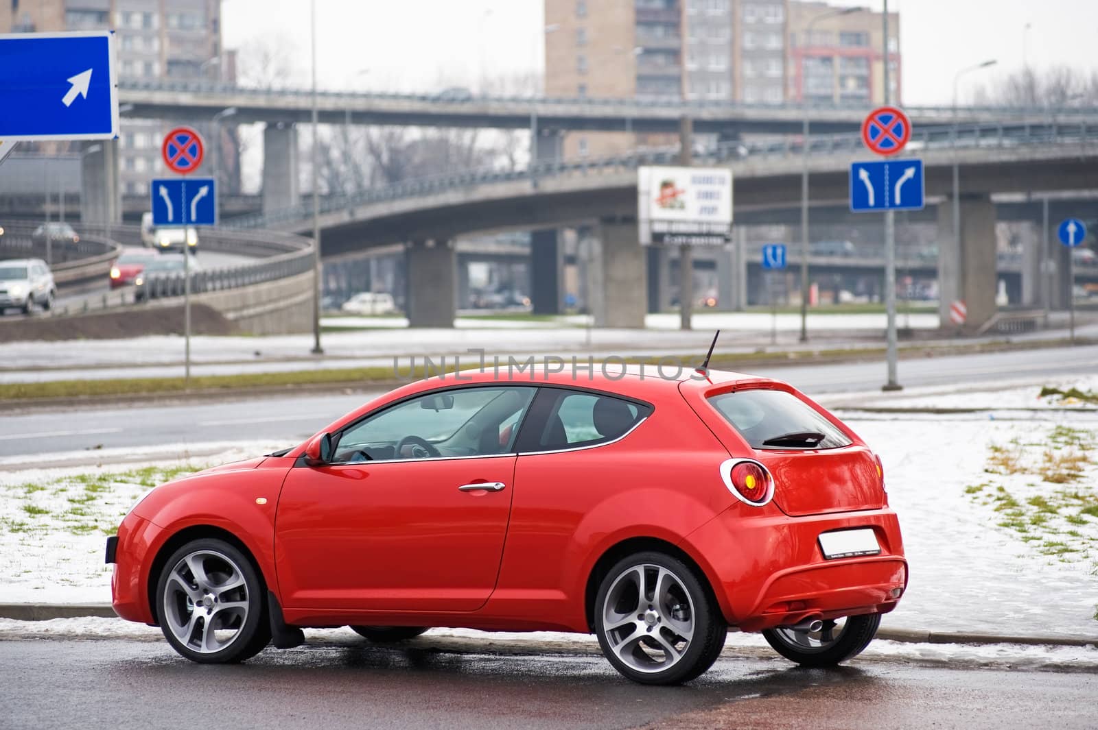 Red car view from side near the bridge, Riga, Latvia