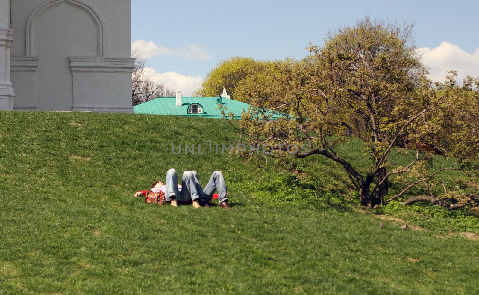 man,  woman, lay, have a rest, knees, feet, people,  person,  tree,  glade,  slope,  grass, green, day, spring,  sun,  sky