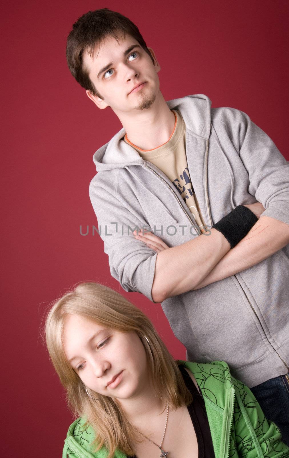 The young girl and the guy on a red background.