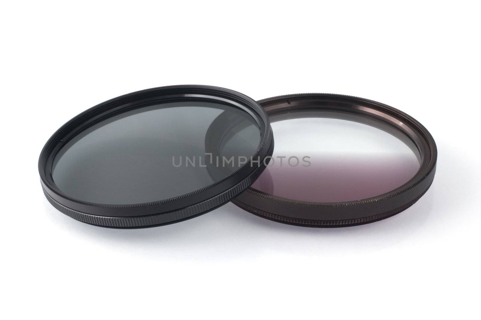 Polarizing filter and graduated NG filter isolated on white