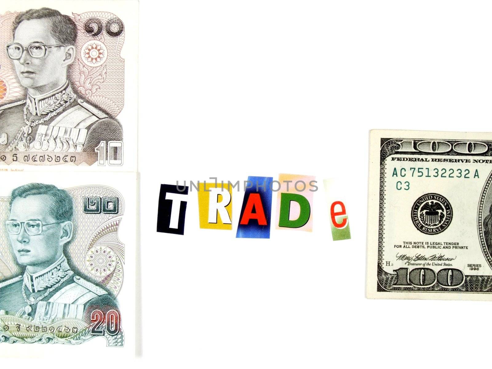 Conceptual photo of Thai and American currency and word "trade" made of magazine clippings.