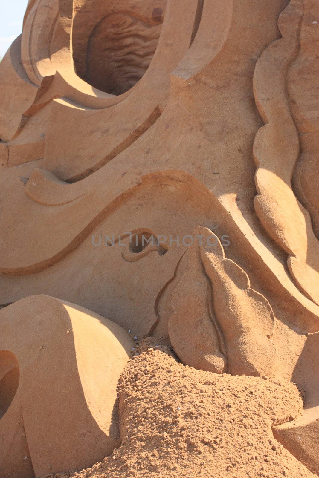 Sculpture, sand, an eye, an exhibition, product, art,  image