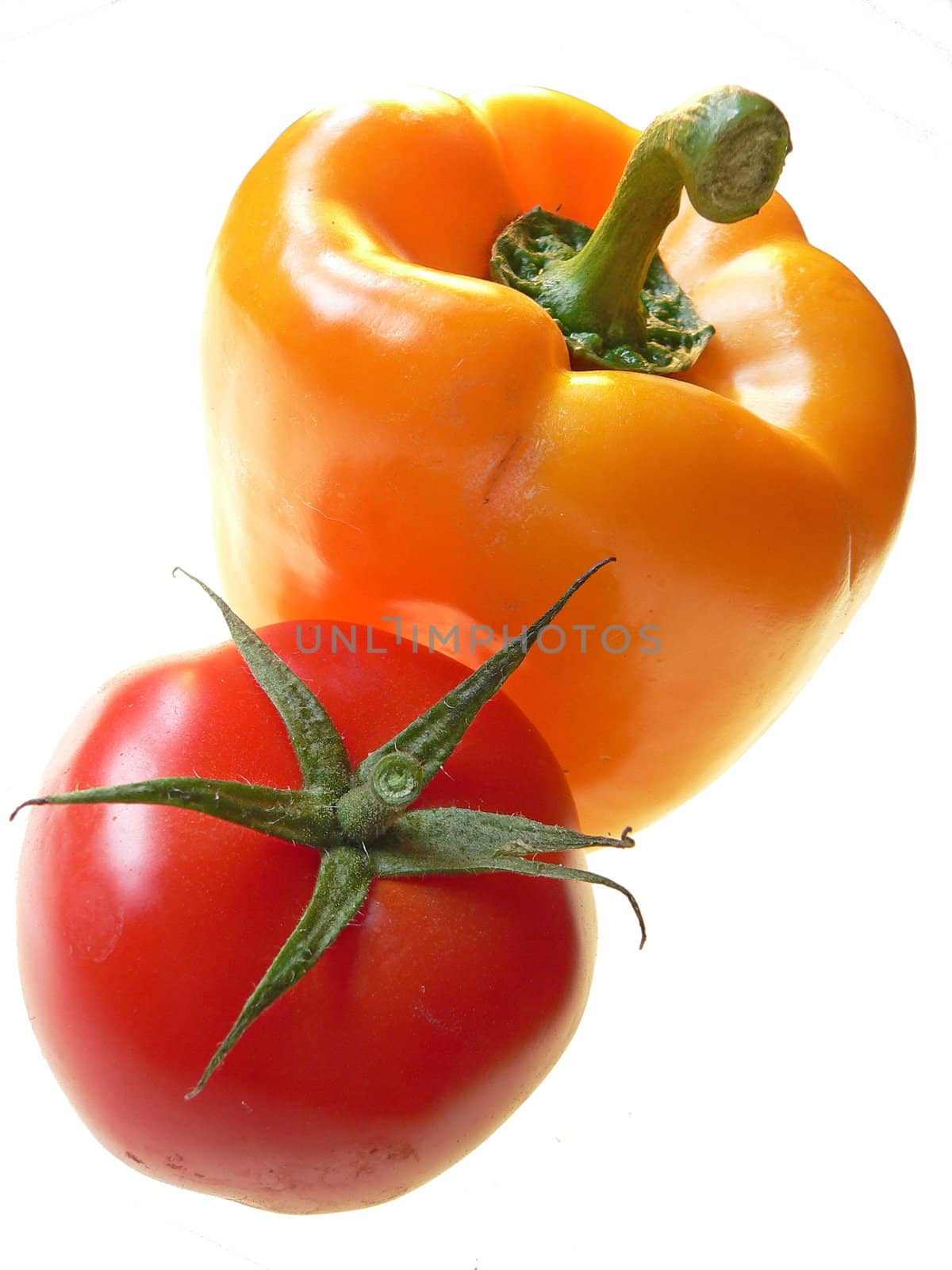 isolated yellow pepper and red tomato