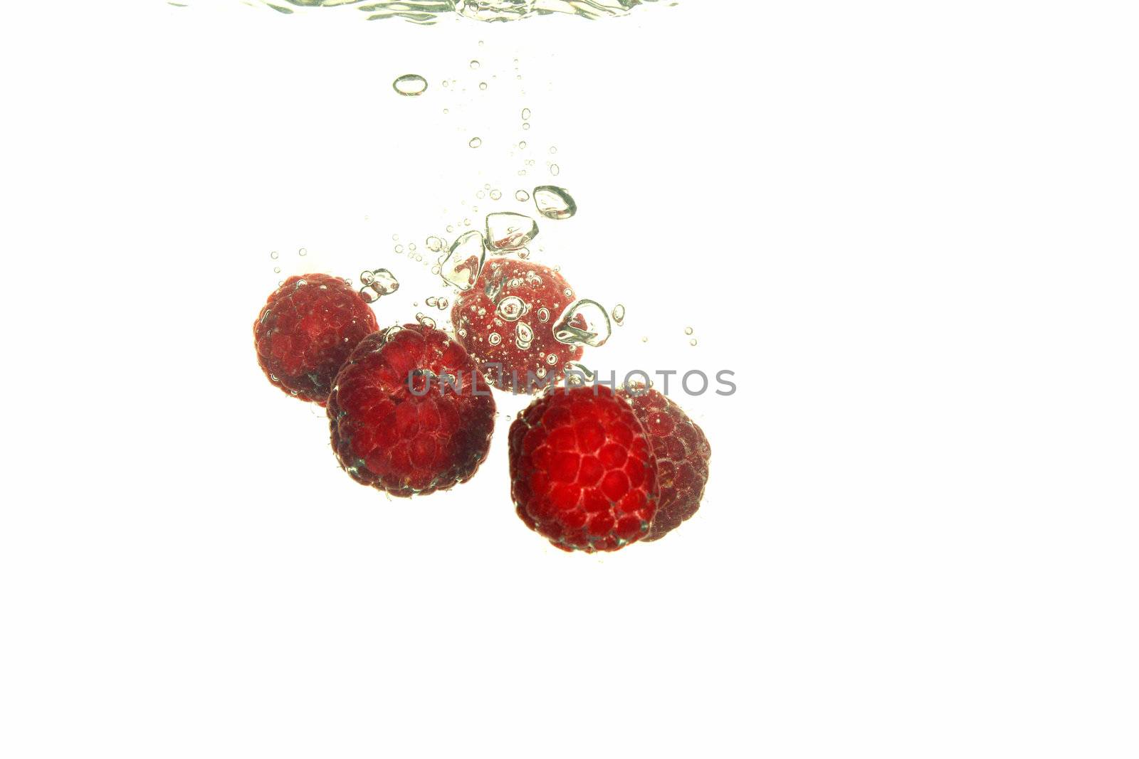  Splash of fresh raspberry to water with bubbles of air