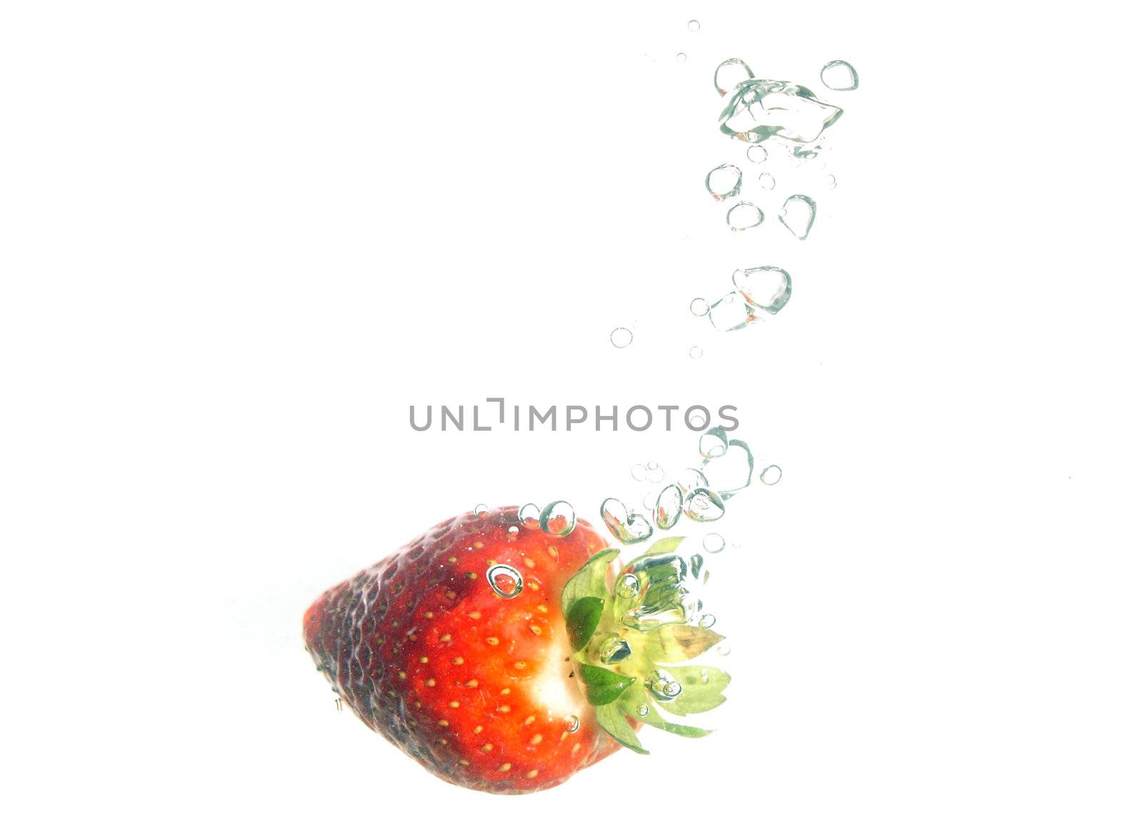  Splash of fresh strawberry to water with bubbles of air