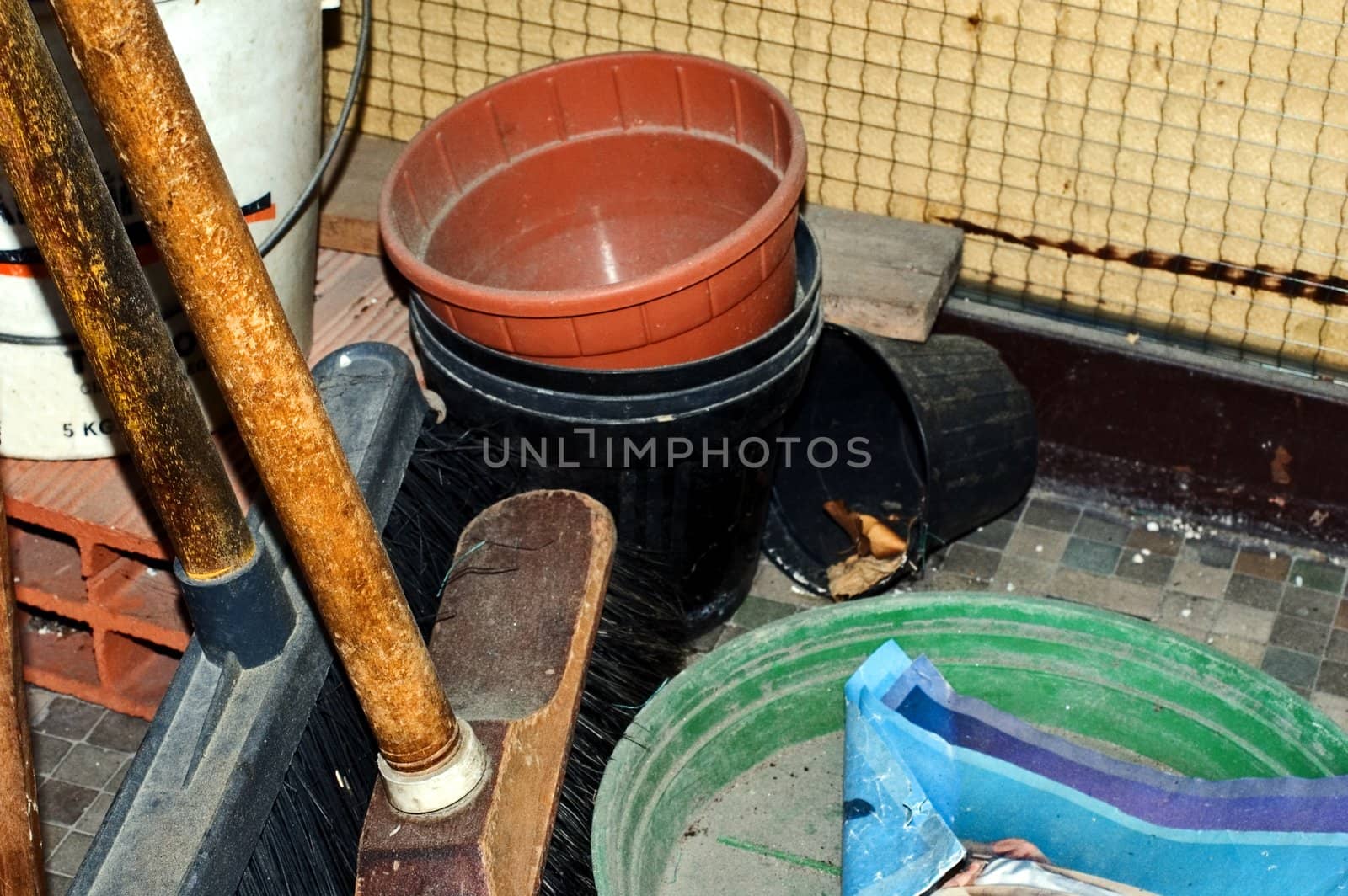 Brooms and plastic vases 