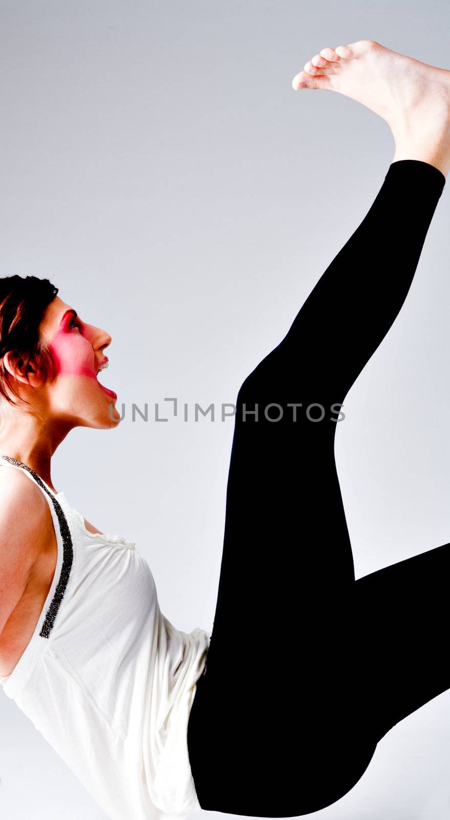 Studio portrait of a tall brunette with extreme make-up on