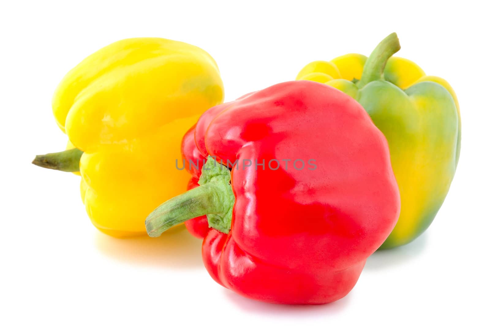 Three peppers (paprika) - red and yellow-green vegetables on overwhite background.