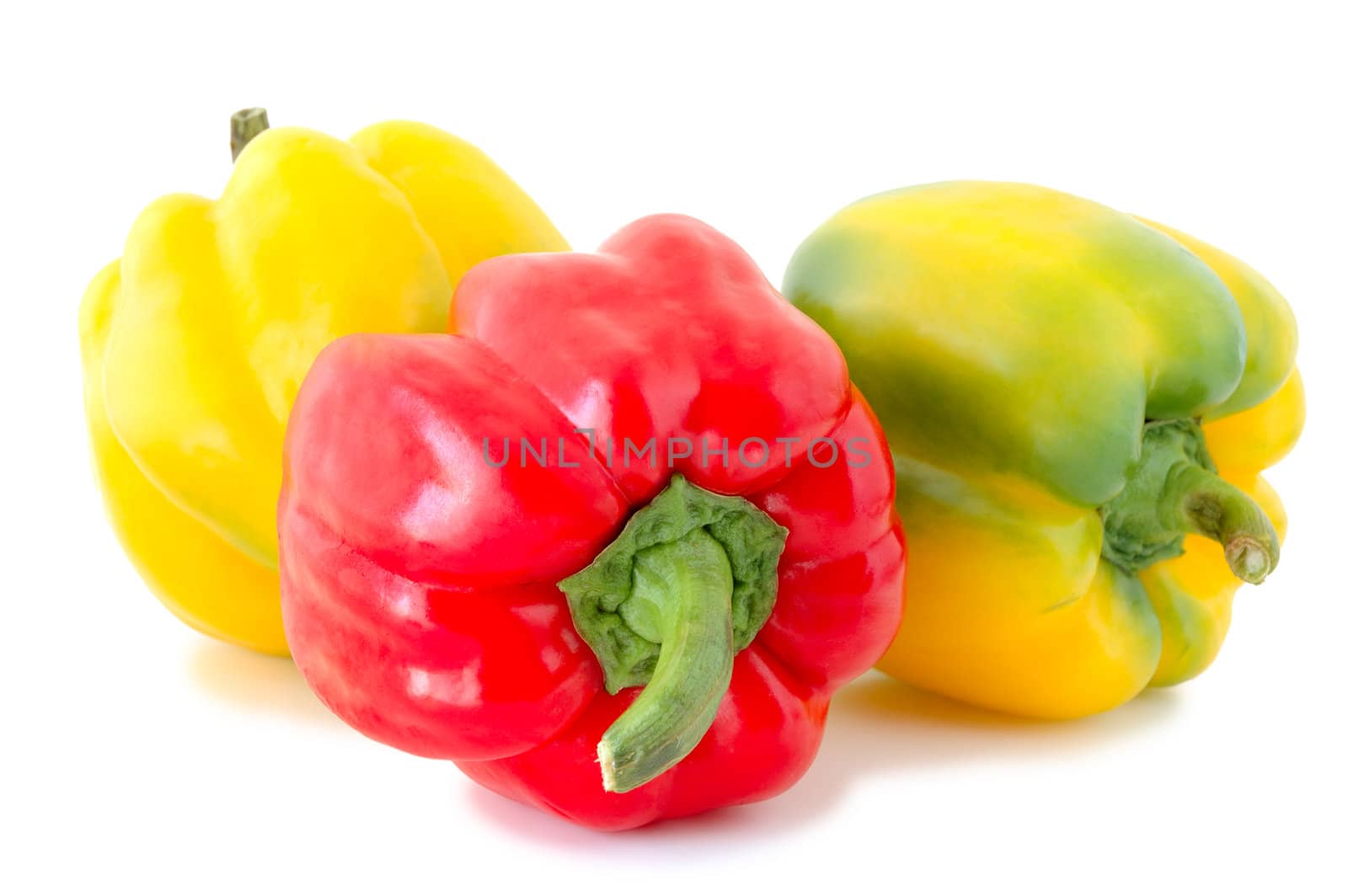 Three peppers (paprika) - red and yellow-green vegetables on overwhite background.