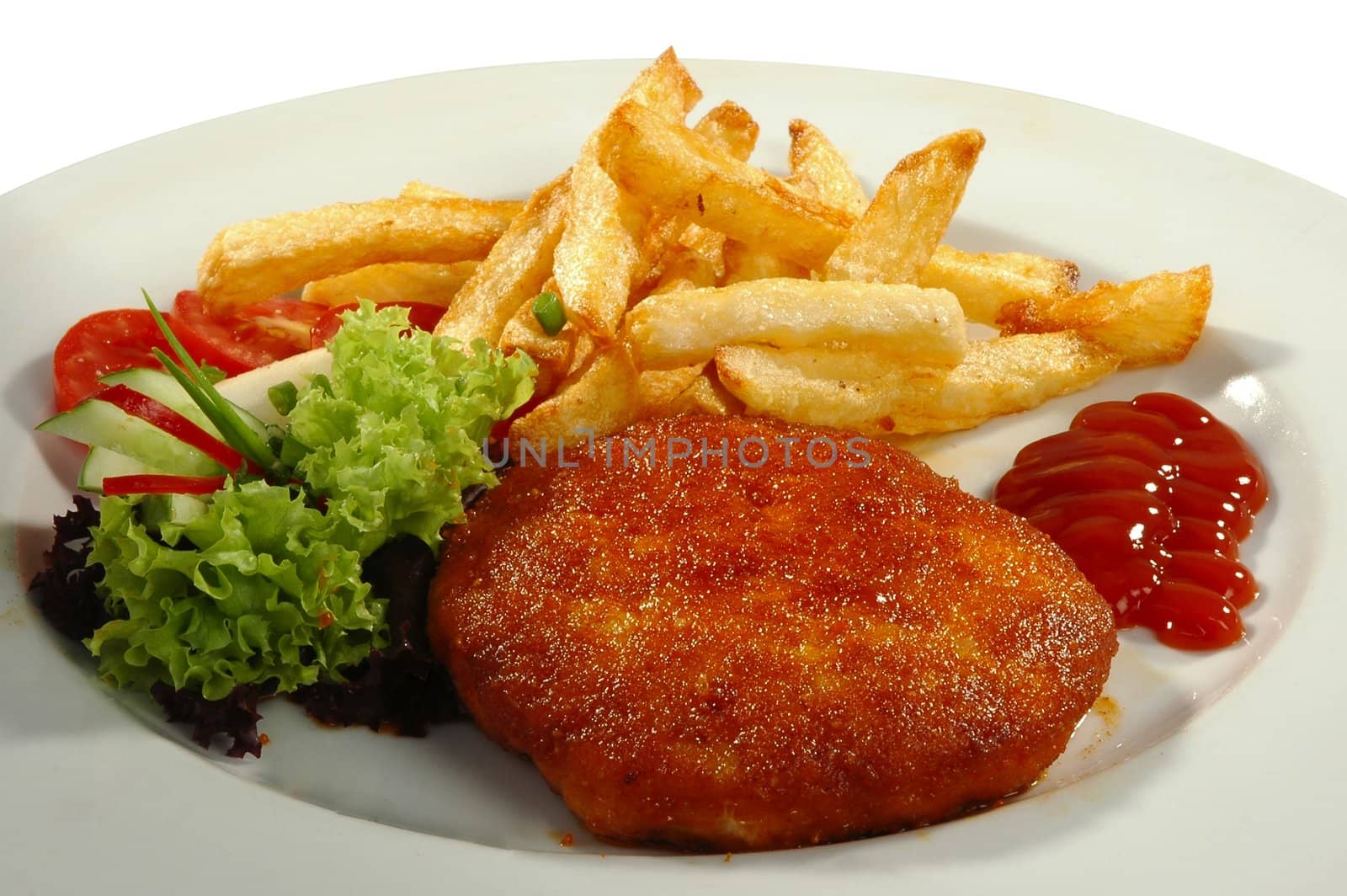friture potatos, cutlet, tomamo, cucumber, salad and sauce on white plate