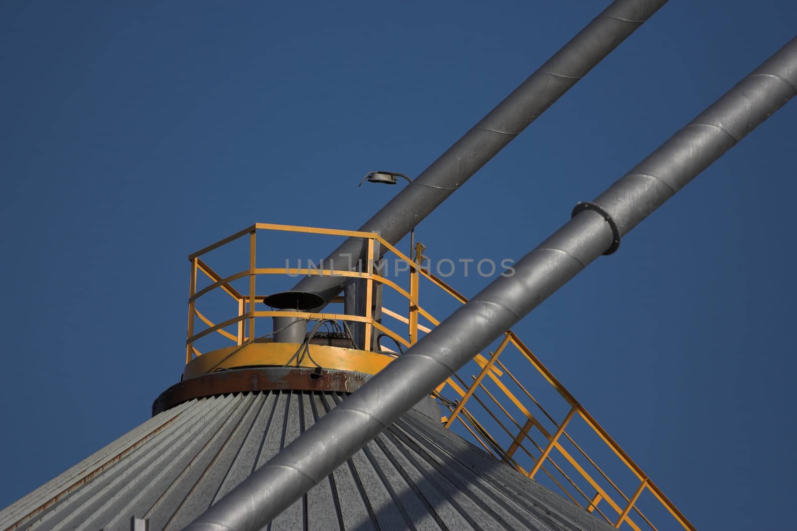 Grain reservoir detail  against a blue sky