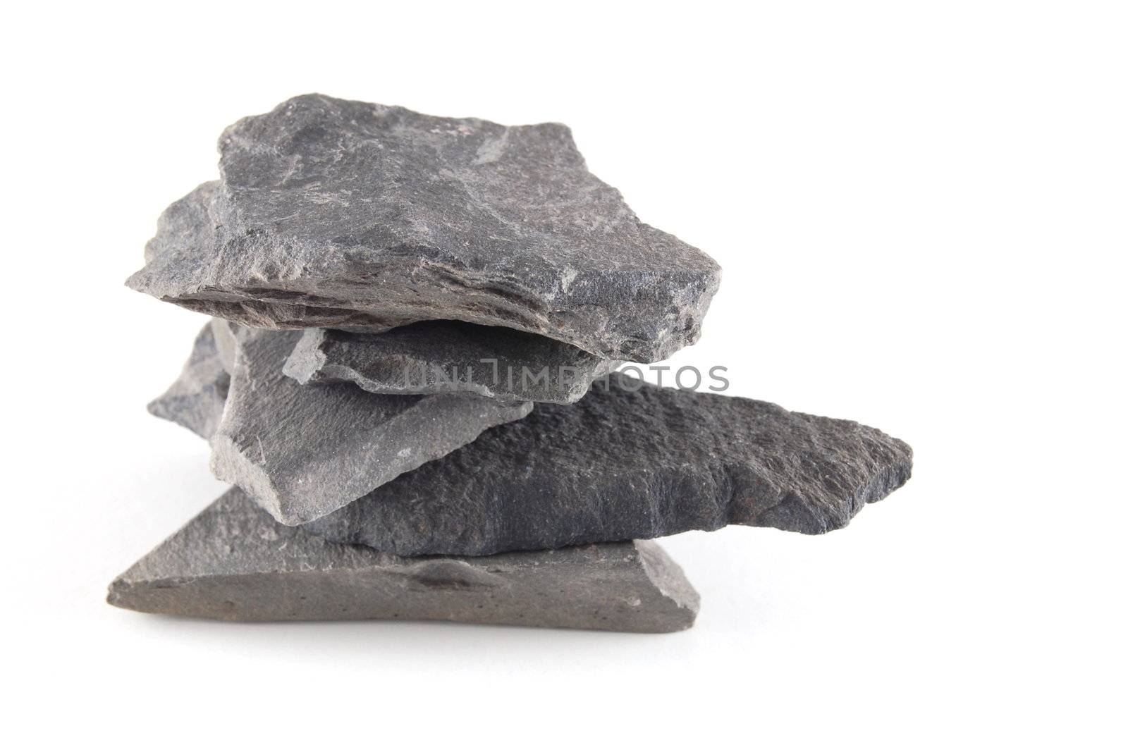 A tower made of stones isolated on a white background.