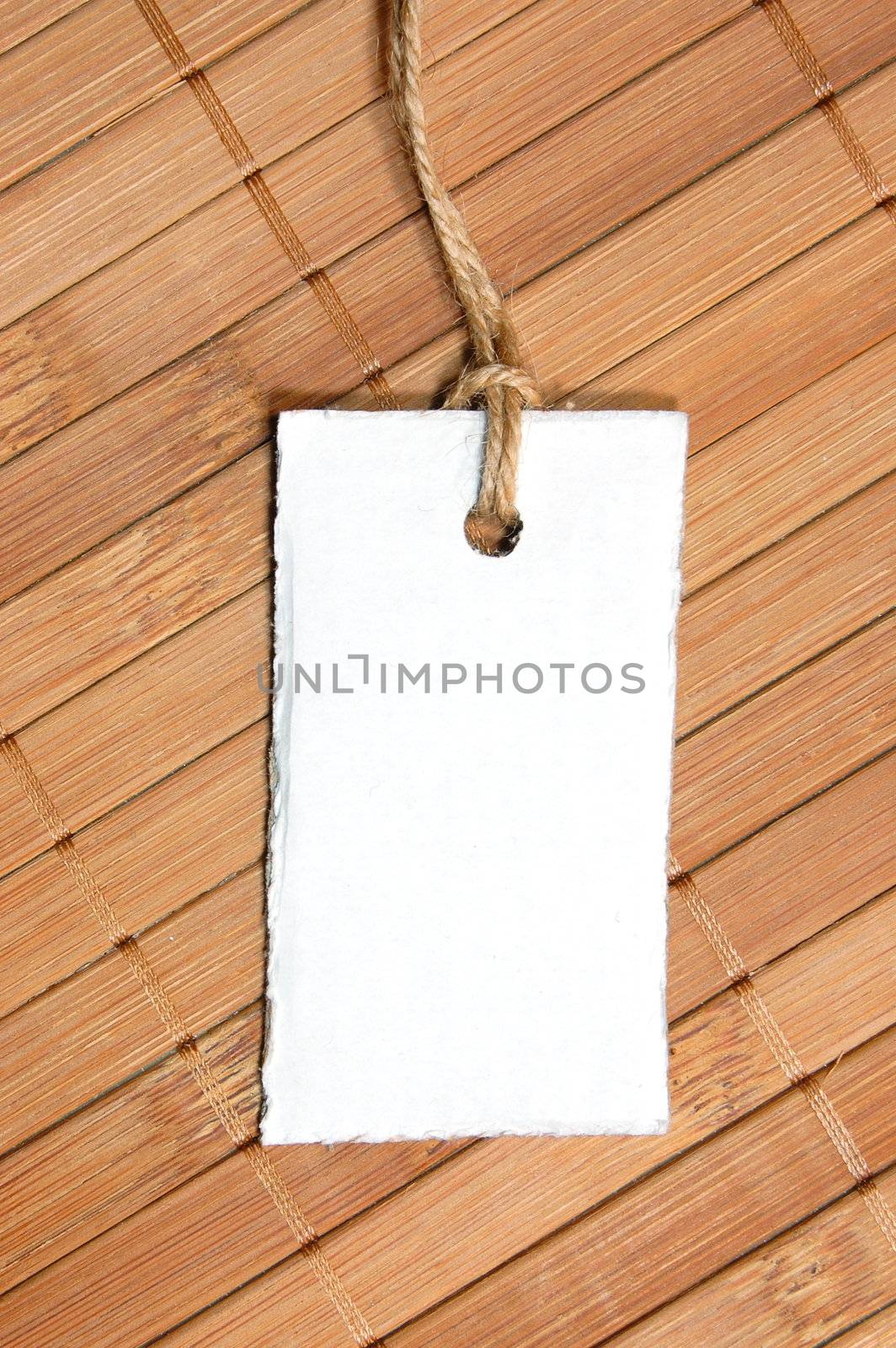 blank price tag with copyspace on a wood texture