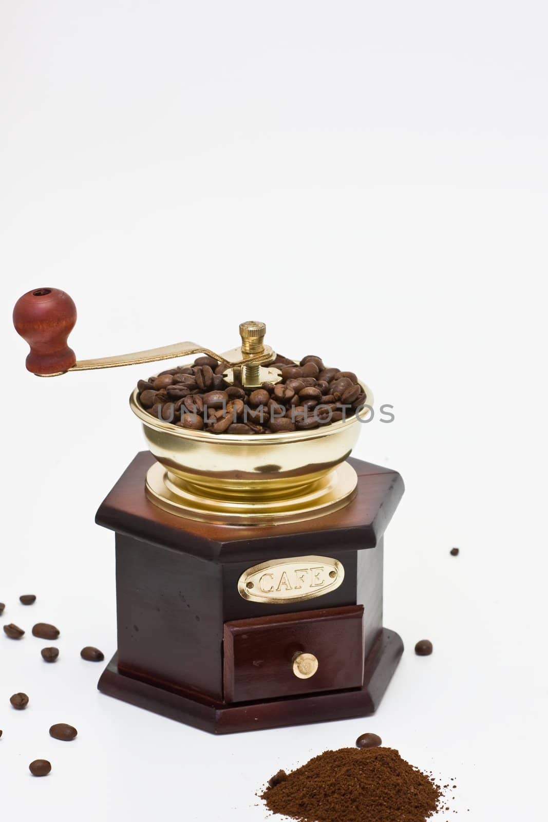 old-fashioned coffee mill on white background