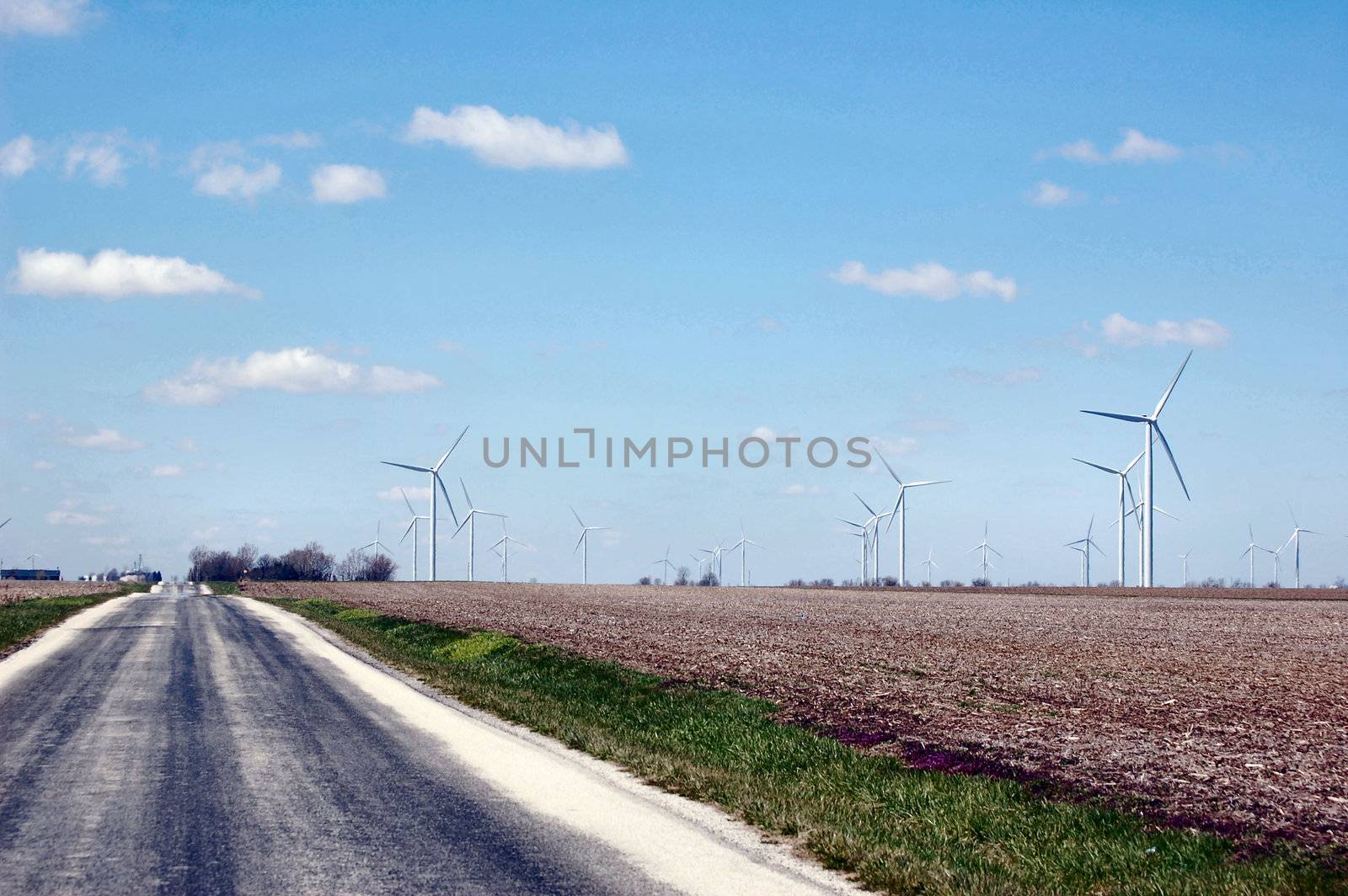 Driving through a wind turbine farm by RefocusPhoto