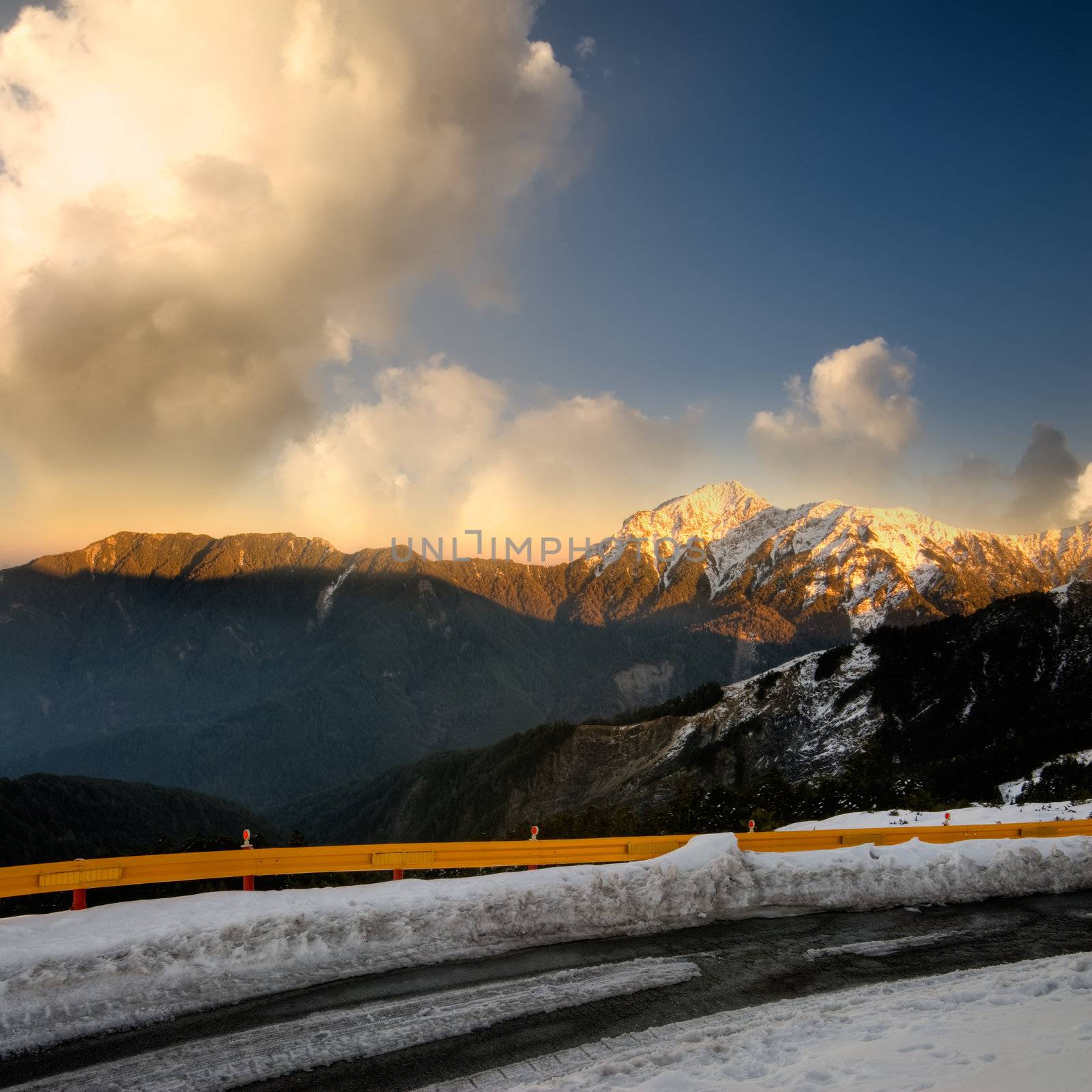 Landscape of dramatic scenery with orange sunset in snow peak in mountain Cilai, Taiwan, Asia.
