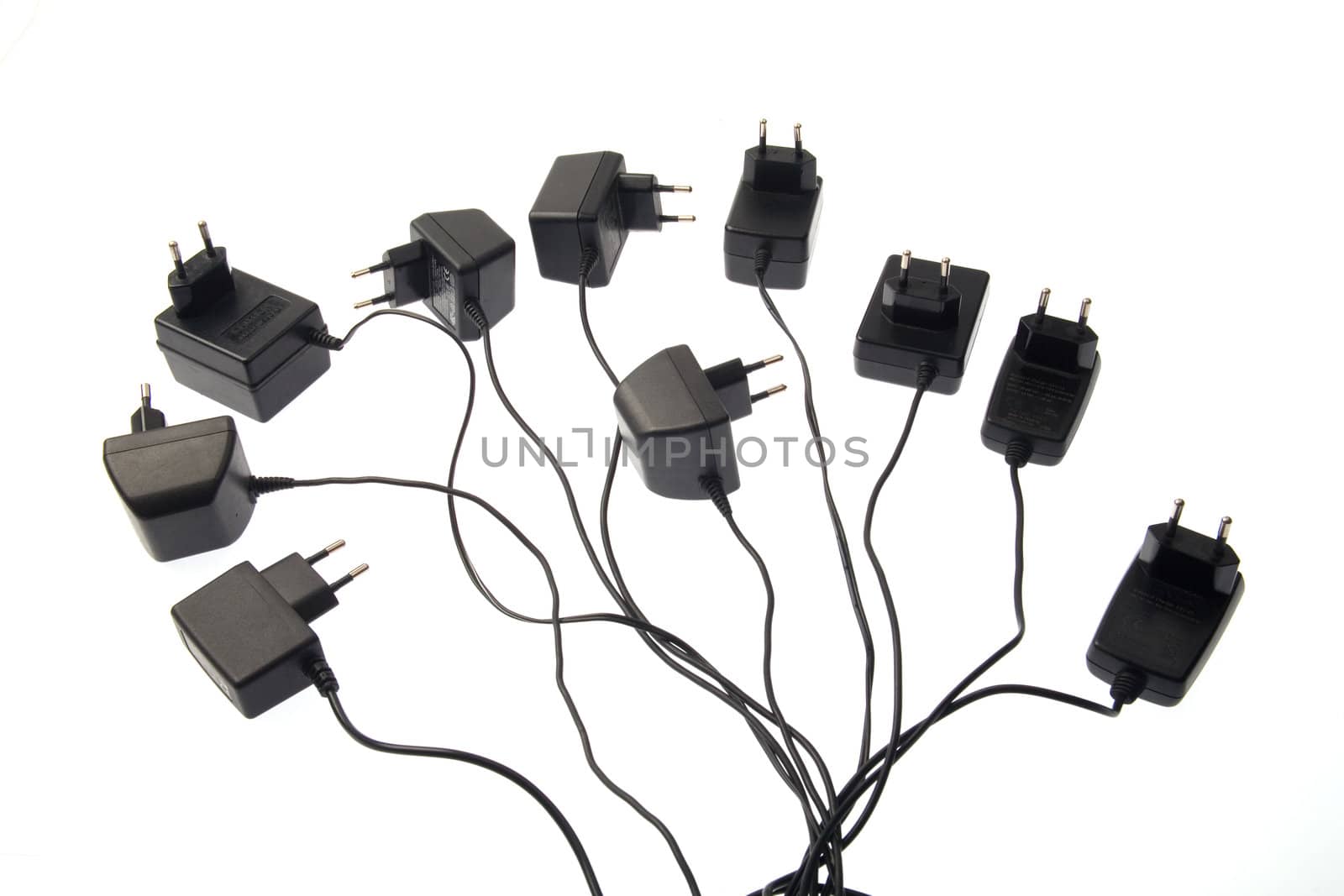 Cell phone chargers isolated over white background.