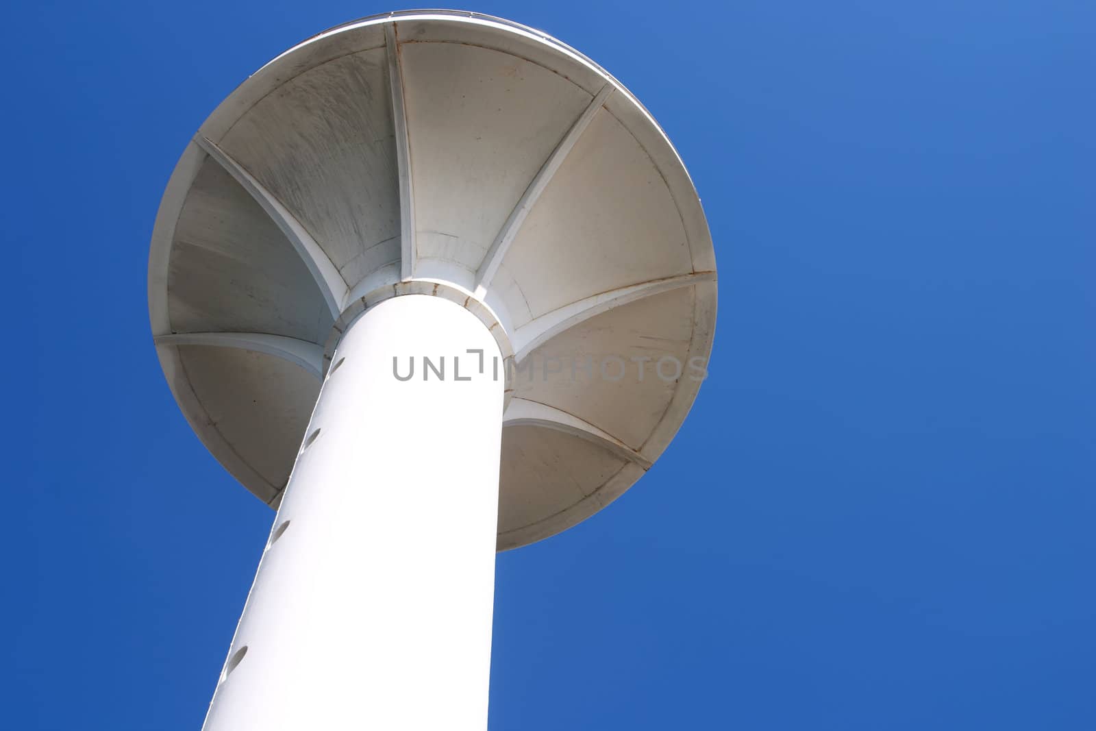 White lighthouse in Istanbul over blue sky