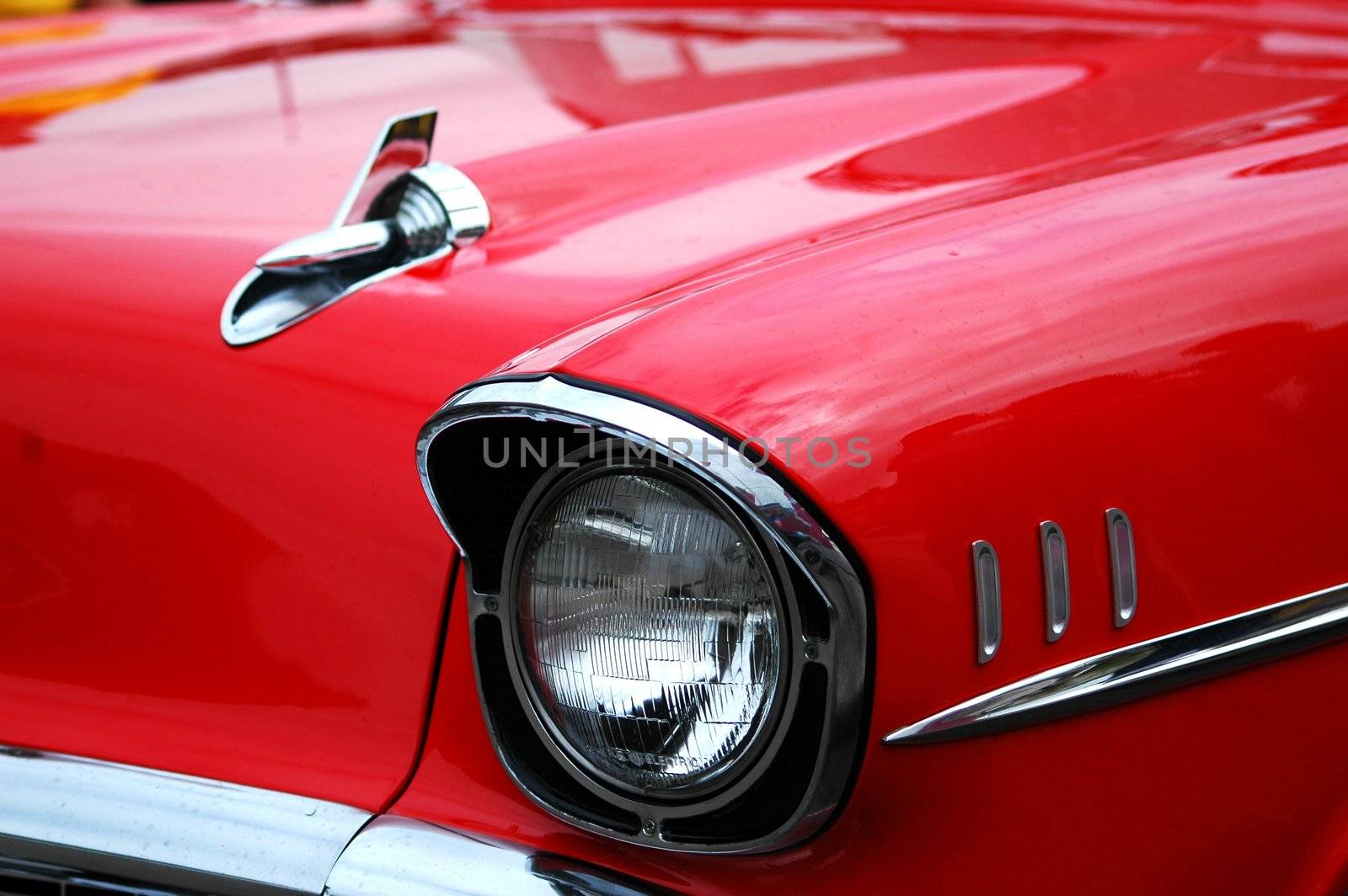 front of red historic jaguar car, horizontally framed shot red historical jaguar car in Cardiff bay