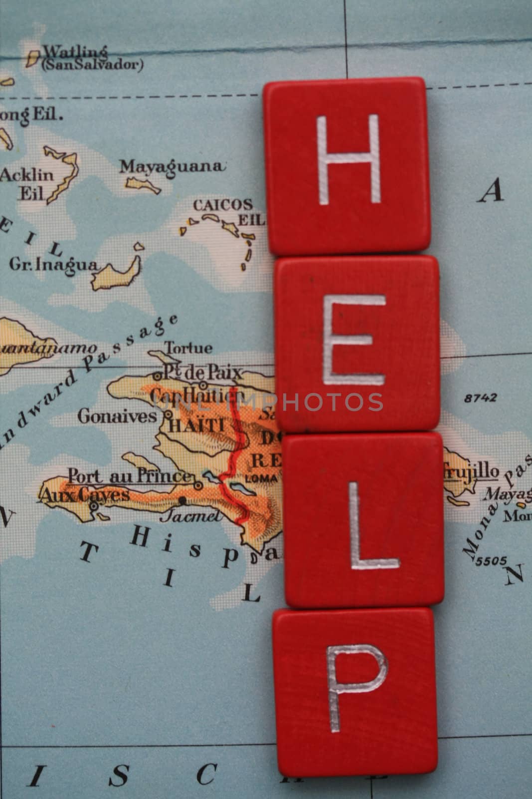 the word help over a vintage 1956 map of Haiti, donation concept
