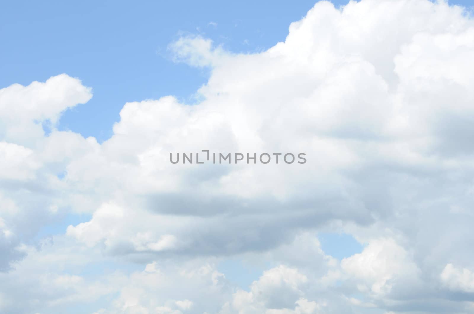 soft blue sky with fluffy clouds