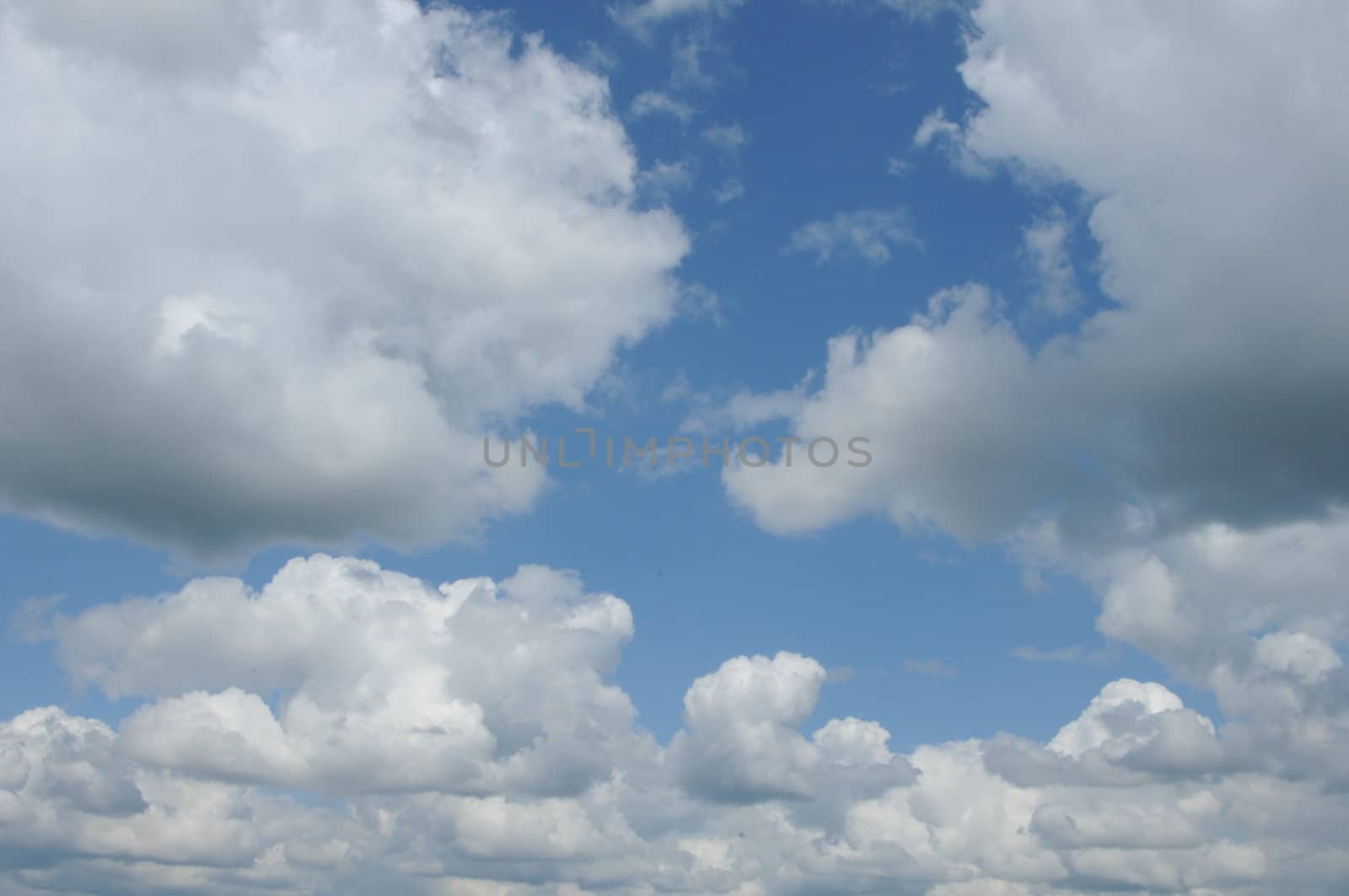 soft blue sky with fluffy clouds